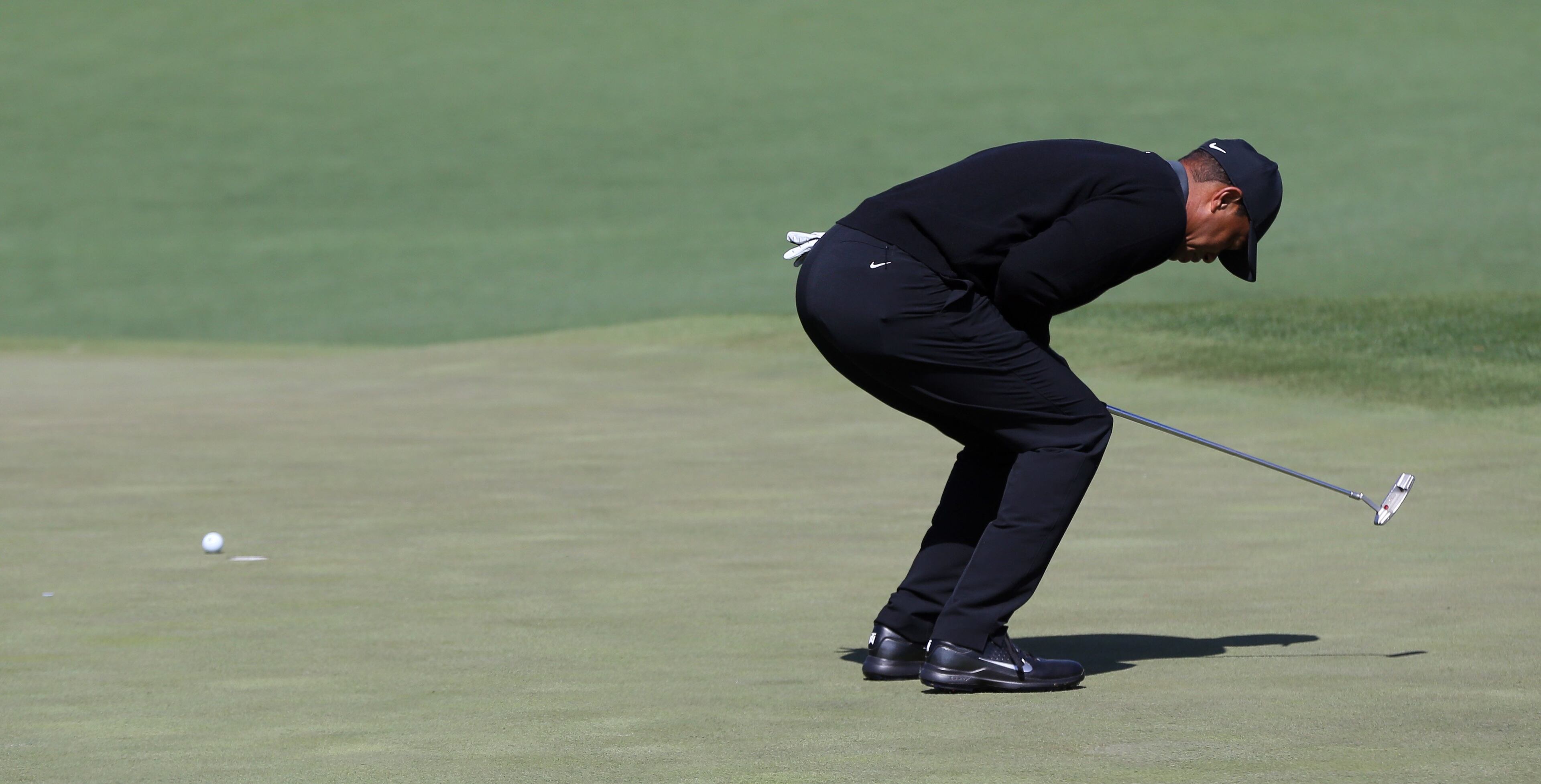 4/5/18 - Augusta - Tiger Woods reacts to missing his birdie put on the second hole during the first round of the Masters at Augusta National Golf Club on Thursday, April 5, 2018, in Augusta. Curtis Compton/ccompton@ajc.com