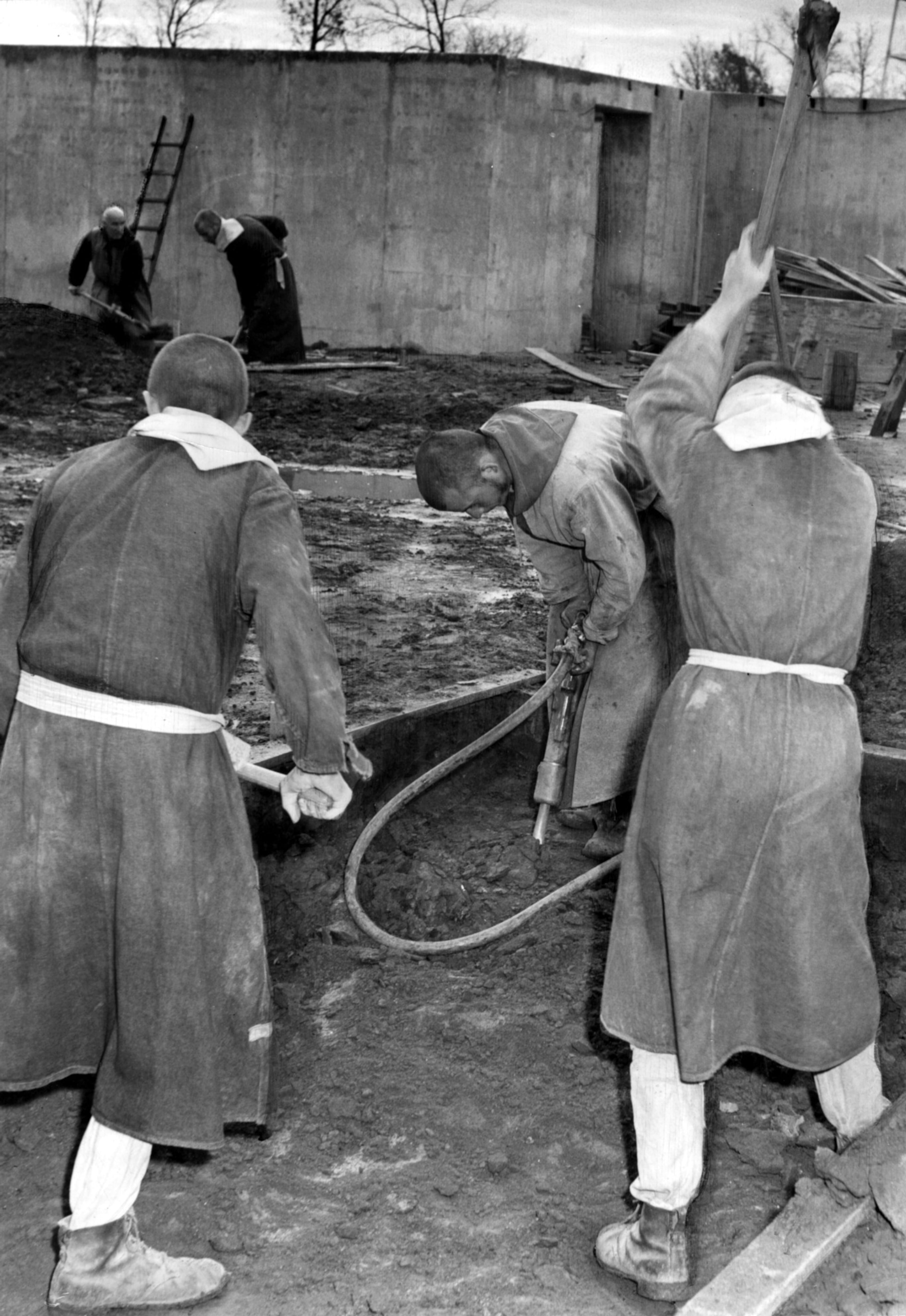 Dec. 11, 1947 -- "Veterans preparing to be Trappist monks wear the order's twelfth-century garb as they use twentieth-century methods to work on the foundation of the new abbey here."