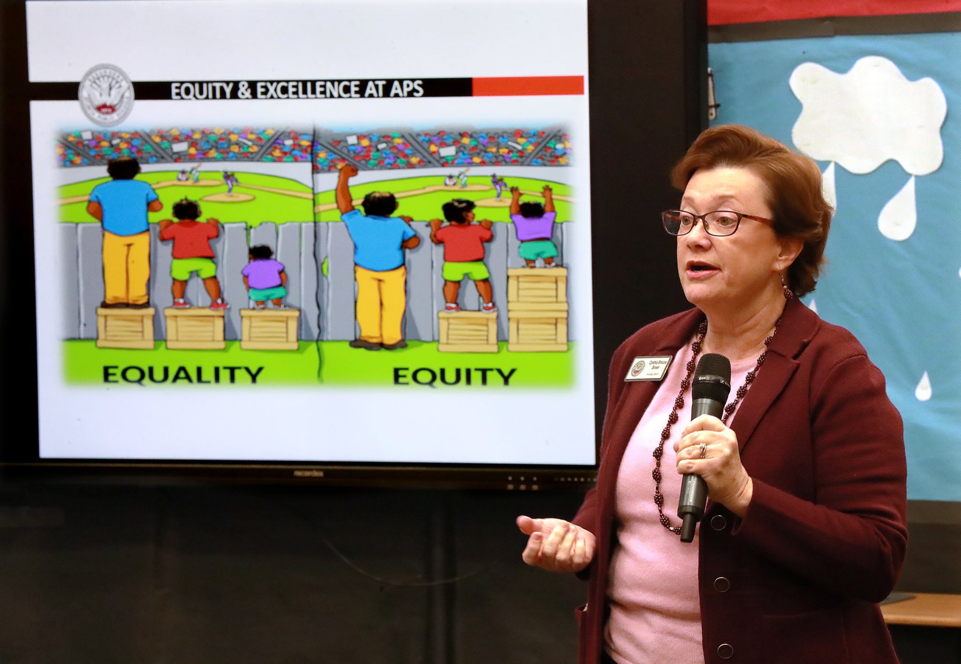 Atlanta school board member Cynthia Briscoe Brown speaks about the district's proposed equity policy during a community meeting at Hope-Hill Elementary School on Feb. 25. Curtis Compton/ccompton@ajc.com