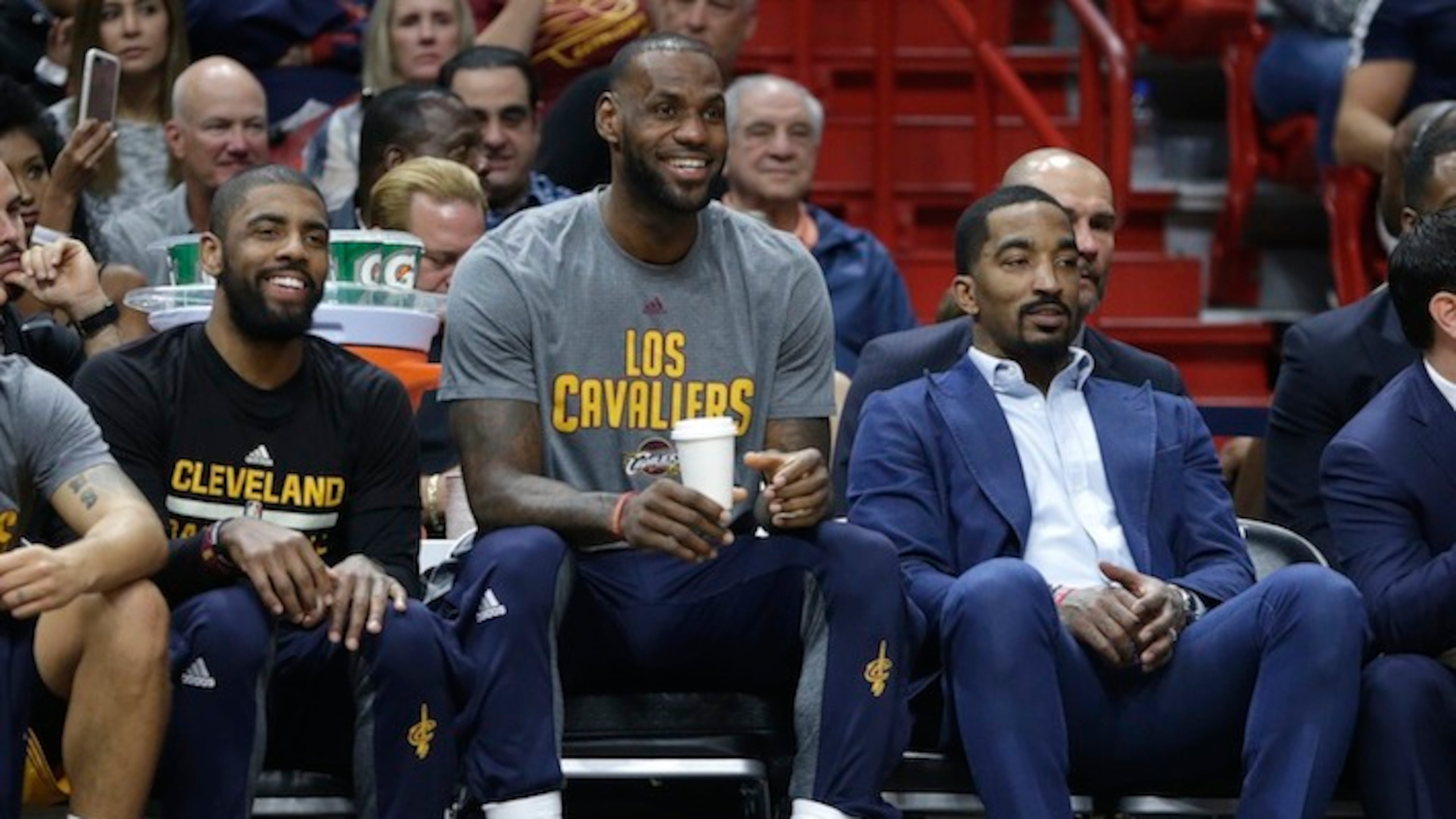 This March 4, 2017, file photo shows Cleveland Cavaliers' Kyrie Irving, left, LeBron James, center, and J.R. Smith, right, watching from the bench during the first half of an NBA basketball game against the Miami Heat, in Miami. Last season, when stars like James, Irving, Kevin Love, Stephen Curry, Klay Thompson, Draymond Green and Andre Iguodala all were given nights off when the Cavaliers or Warriors were playing nationally televised games on ABC, there was no shortage of scorn. This season, teams playing in those marquee ABC games will have a day off both before and after those contests. (AP Photo/Lynne Sladky)