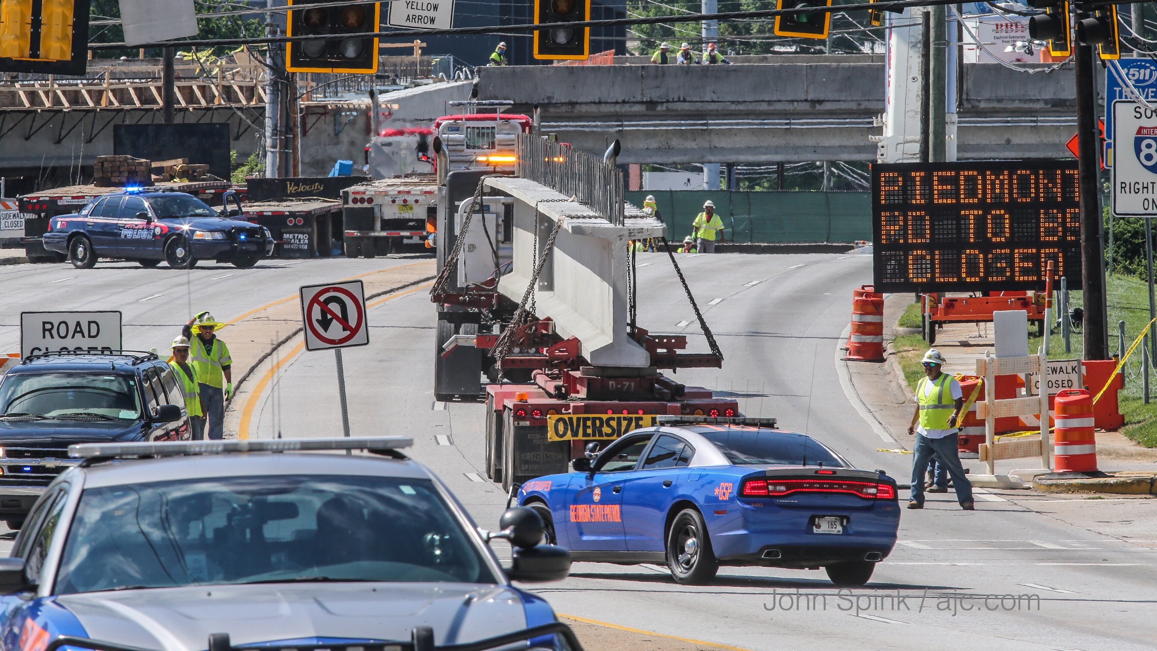 Piedmont Road is closed for 24 hours so crews can continue work to rebuild the I-85 bridge, according to the Georgia Department of Transportation. The road closed at 9 a.m. Tuesday. JOHN SPINK / JSPINK@AJC.COM