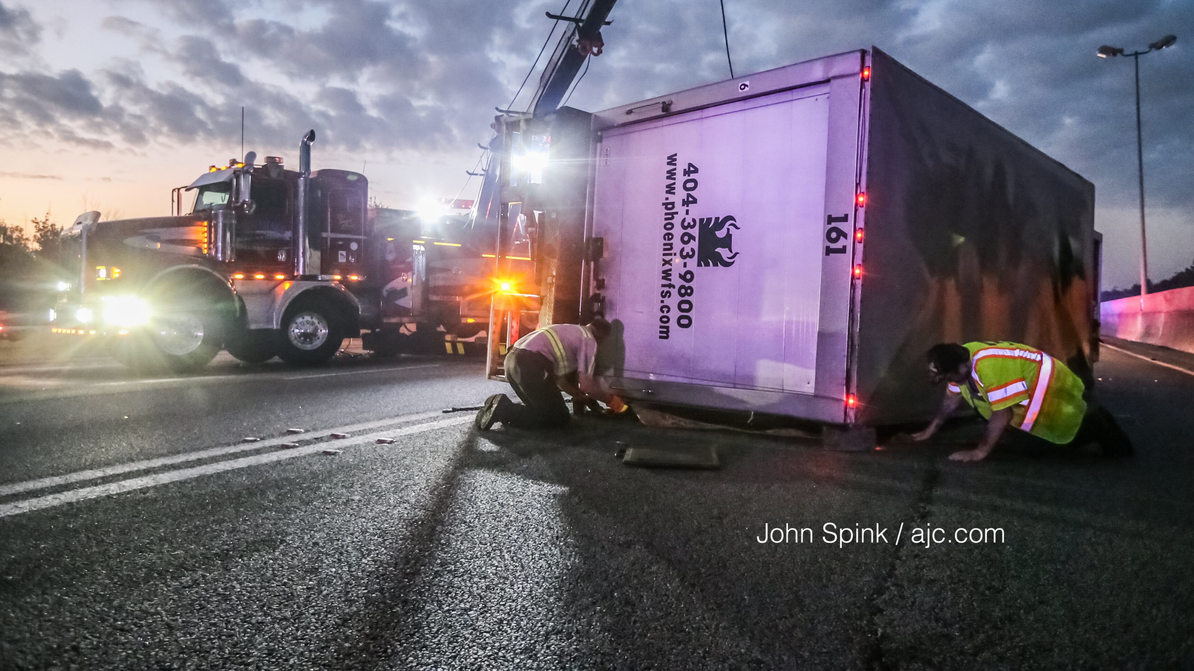 An overturned box truck on I-75 North at Central Avenue caused heavy delays between Clayton County and downtown Atlanta early Monday, authorities said.