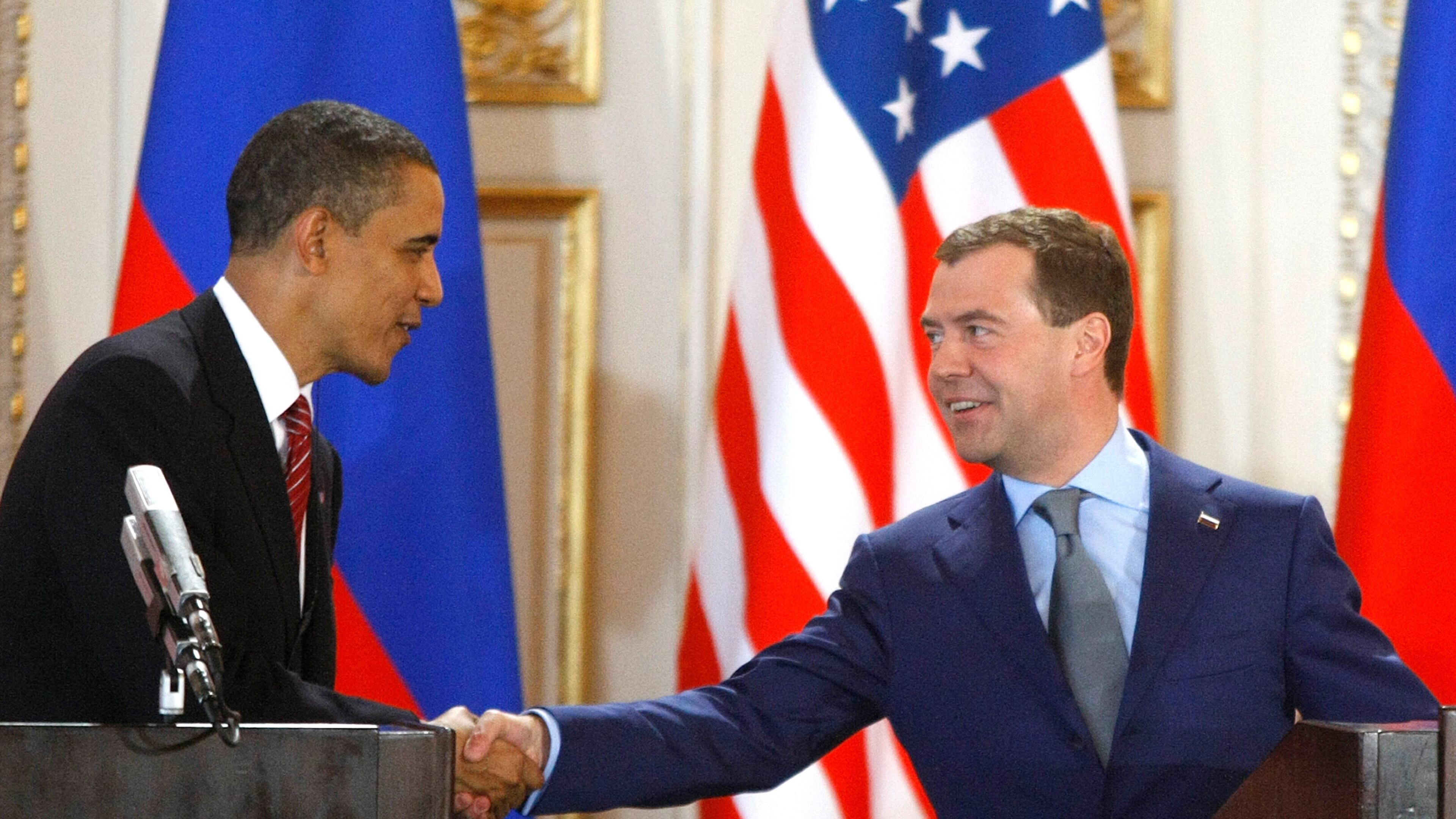 FILE - U.S. President Barack Obama, left, and his Russian counterpart Dmitry Medvedev, right, shake hands at a news conference at the Prague Castle in Prague, Czech Republic,, April 8, 2010, after signing the New START treaty reducing long-range nuclear weapons. (AP Photo/Mikhail Metzel, File)