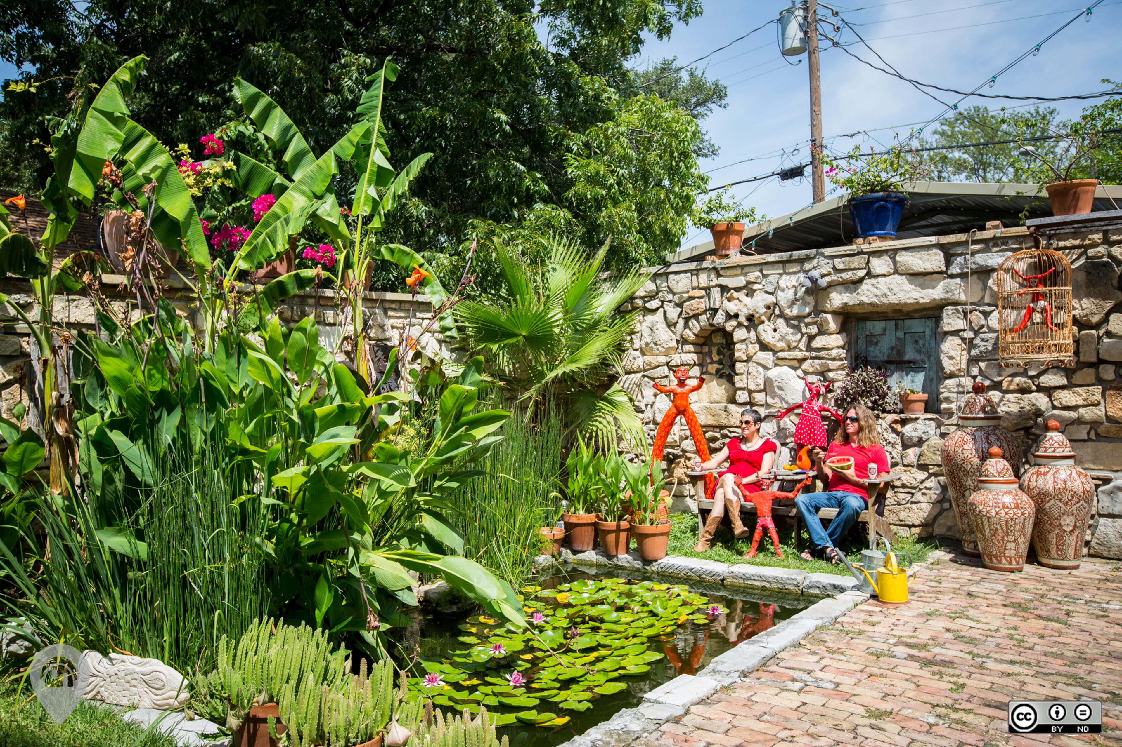 This Mexico-inspired hacienda is the hidden artist's retreat of owners Darryl Freeman and his wife. Behind its hand built, 6-foot limestone walls, one finds a chicken yard, two koi ponds, an aviary, many tropical and native Texas plants, and a rain collection system that sustains it all. There is an art studio and a private acupuncture practice here on the property, an urban oasis. The studio and home are full of strange, original, oil paintings and many unique treasures gathered in their over 20 years of travel and adventure together.