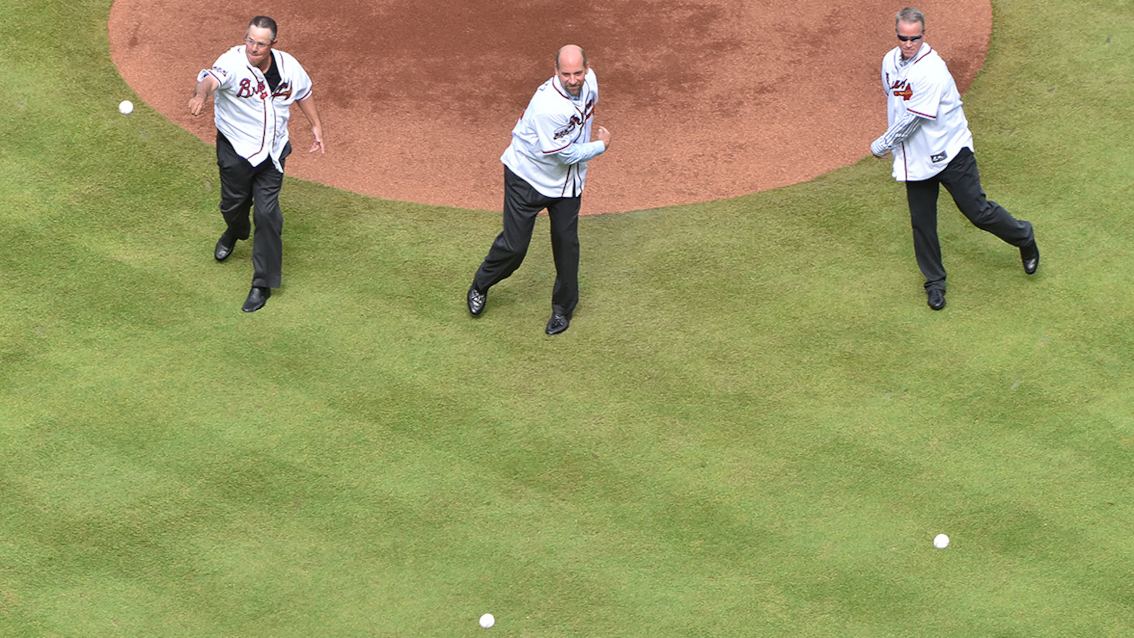 October 2, 2016 Atlanta - Longtime Atlanta Braves pitchers (from left) Greg Maddux, John Smoltz and Tom Glavine throw first pitch during pregame ceremony before the final Atlanta Braves game against the Detroit Tigers at Turner Field on Sunday, October 2, 2016. HYOSUB SHIN / HSHIN@AJC.COM
