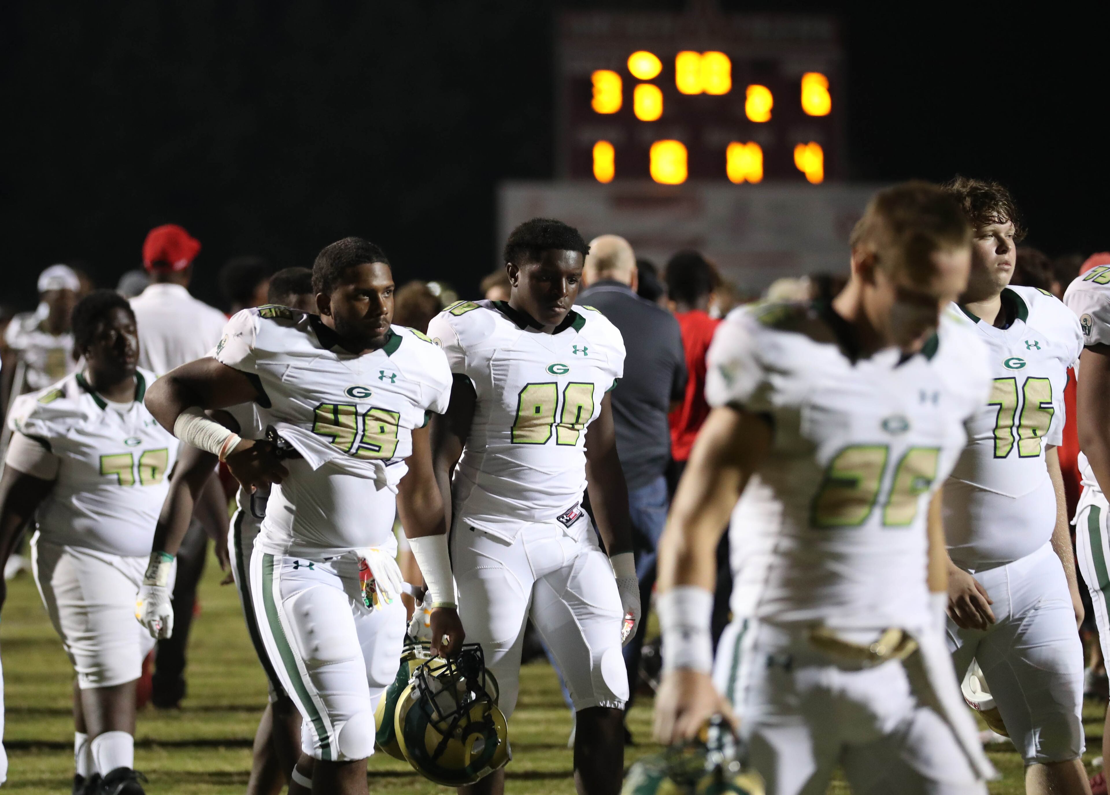Grayson players walk off the field after their loss to Archer at Archer High School Friday, October 13, 2017, in Lawrenceville, Ga.. Archer defeated Grayson 6-3. PHOTO / JASON GETZ