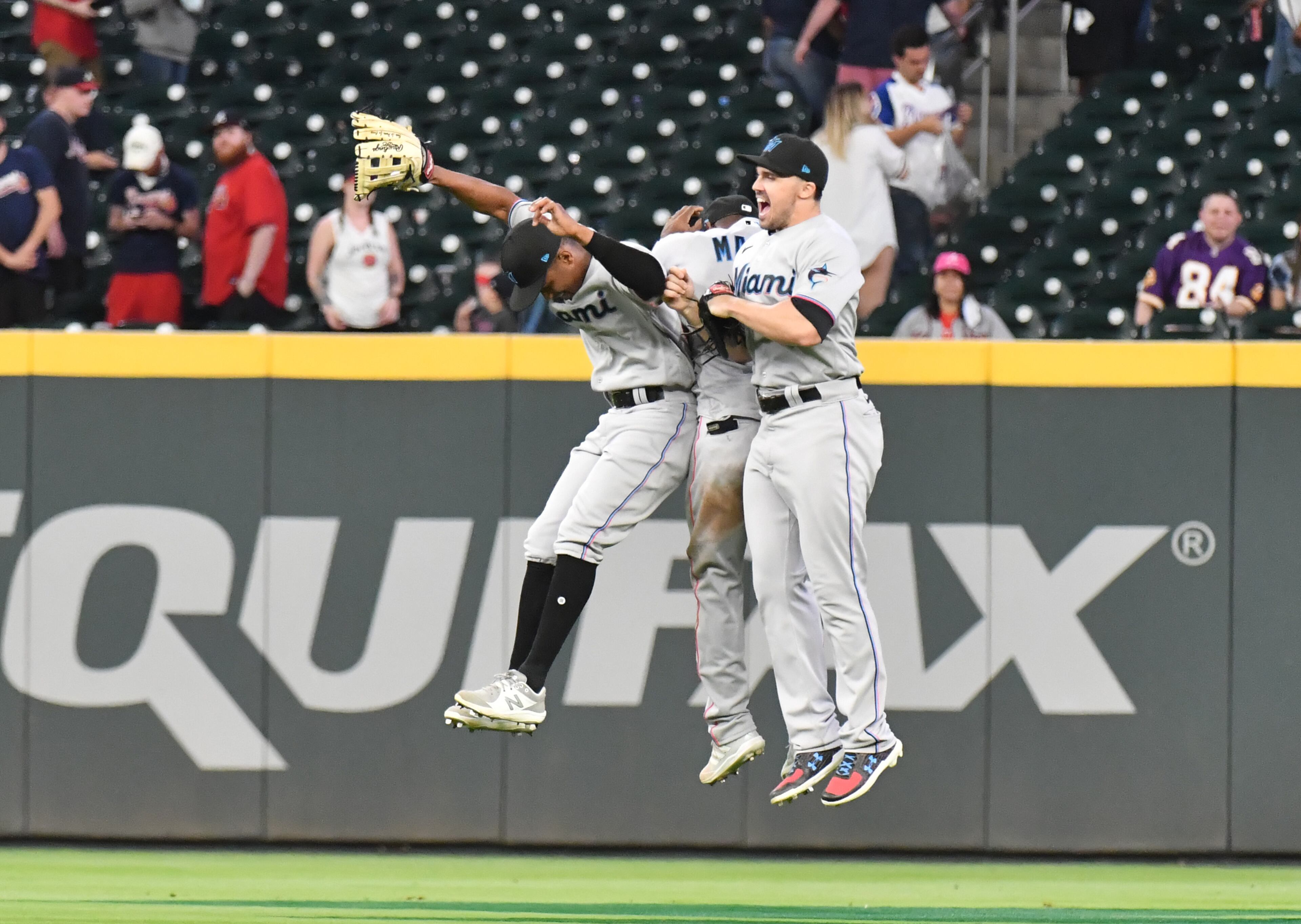 April 12, 2021 Atlanta - Miami Marlins players celebrate their win in the 10th inning at Truist Park on Monday, April 12, 2021. Miami Marlins won 5-3 over Atlanta Braves in an extra inning. (Hyosub Shin / Hyosub.Shin@ajc.com)