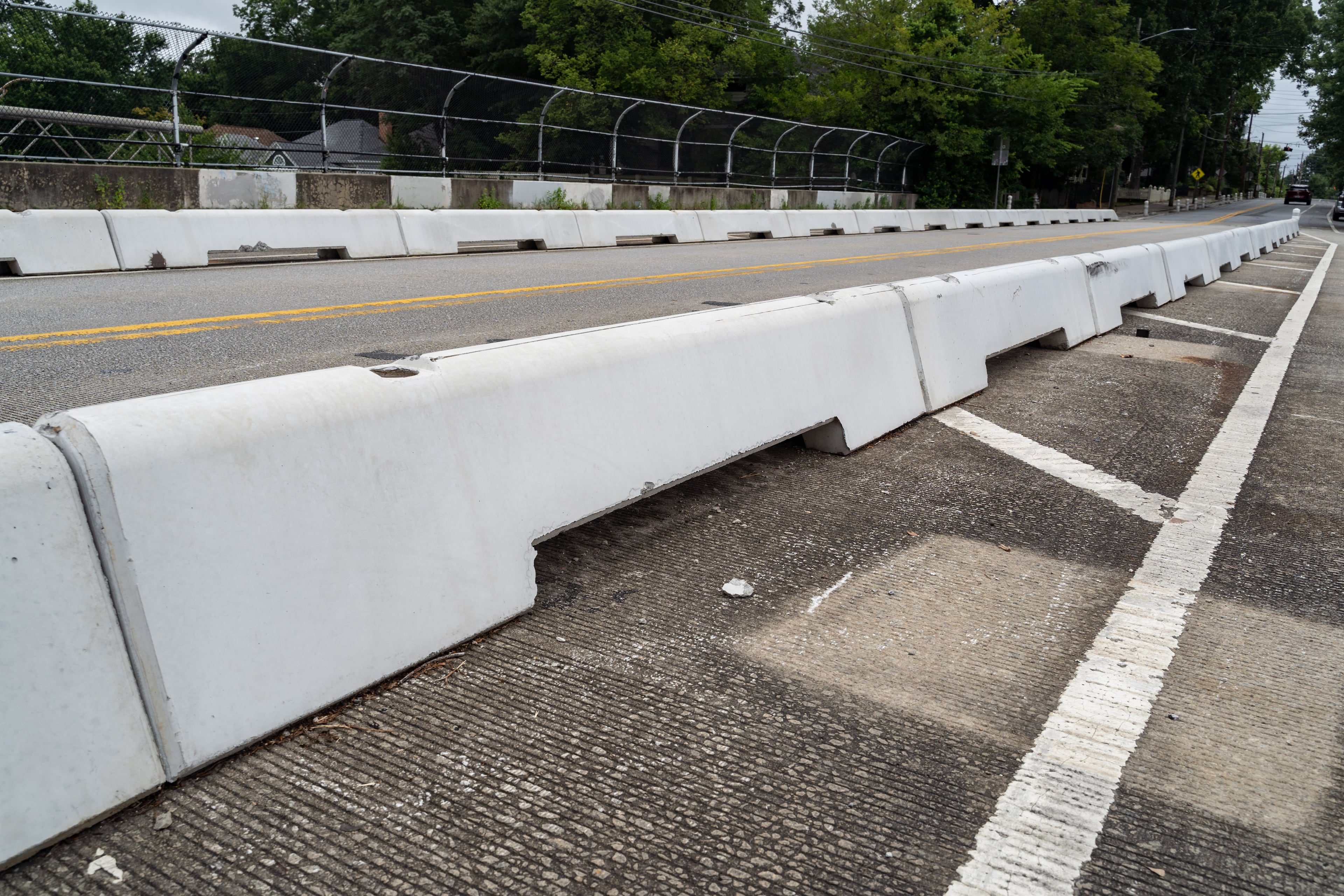 Concrete bike lane barriers line Cherokee Avenue Southeast on Monday, July 13, 2026. (Ben Hendren for the AJC)