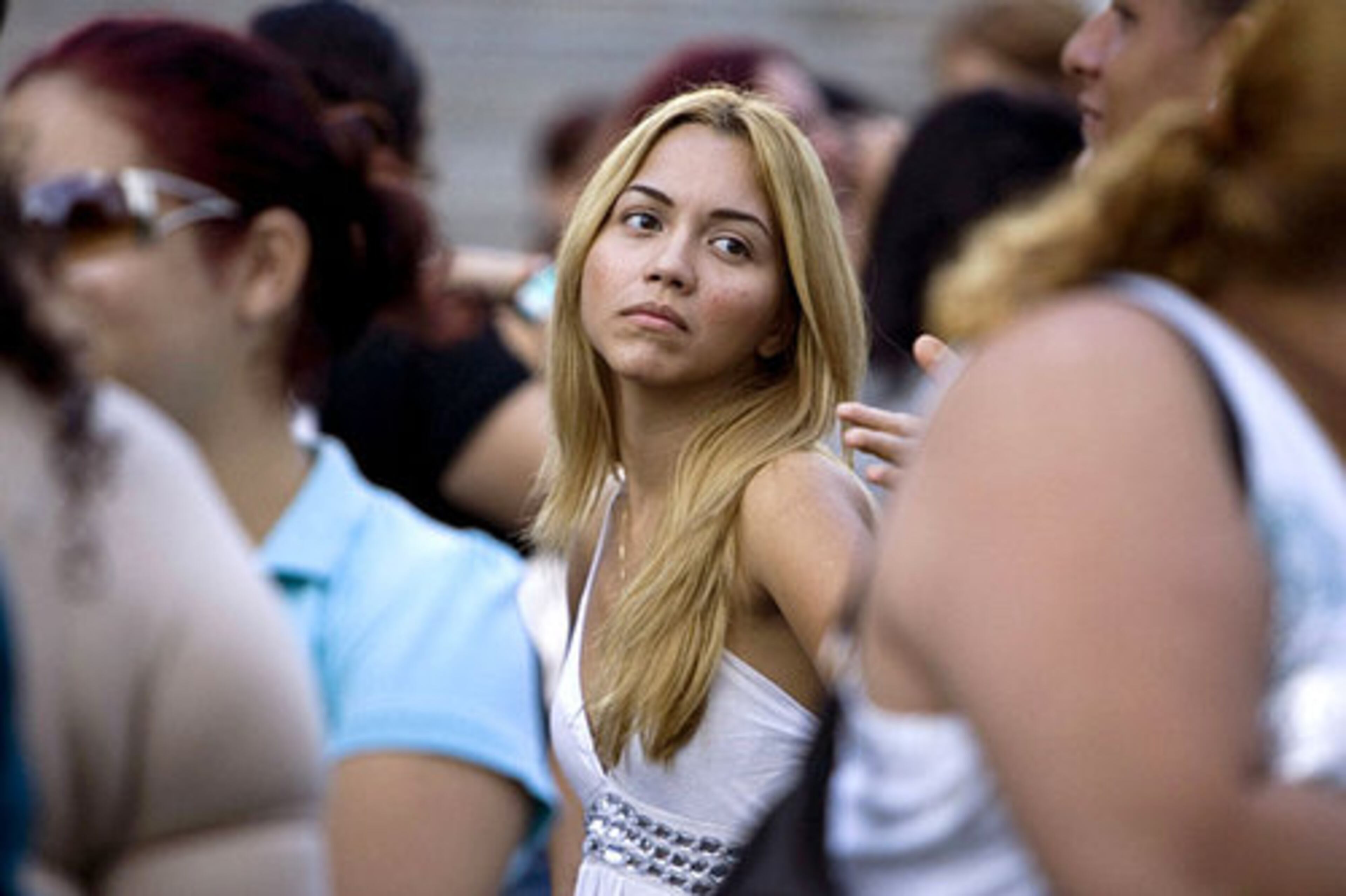 Sheila Michelle, 24, center, of Yauco, in rural southern Puerto Rico, waits with other contestants to sing at the audition.