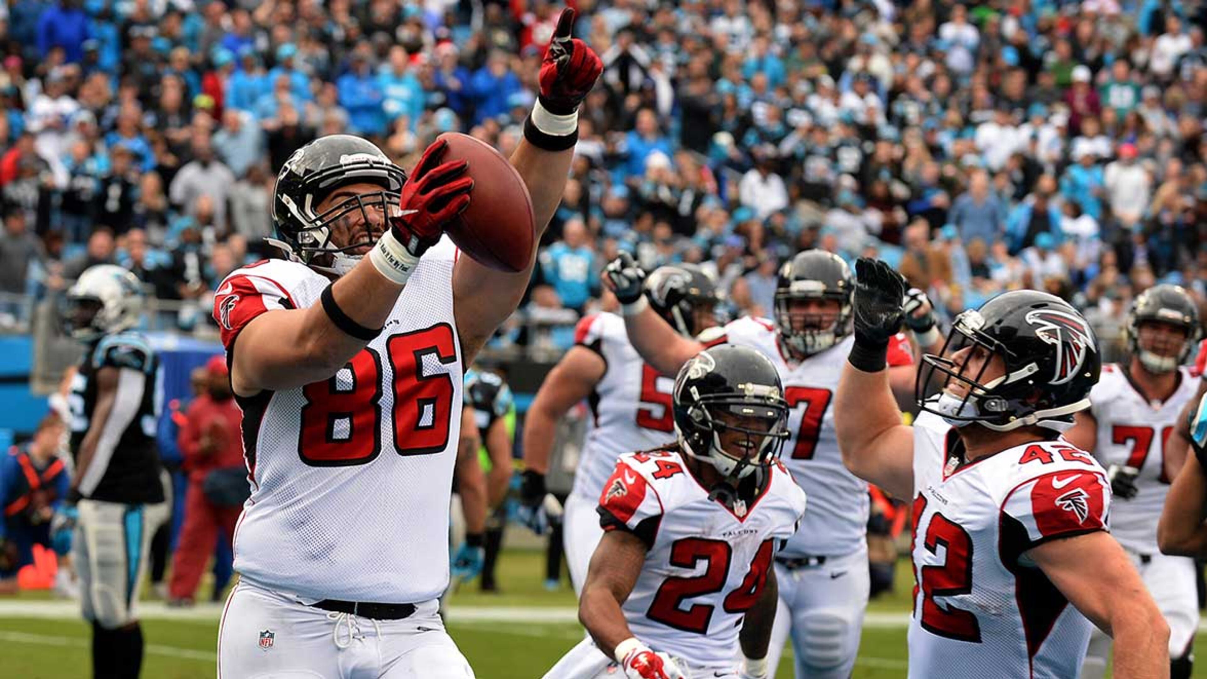 Atlanta Falcons tight end D.J. Tialavea (86) celebrates his touchdown pass reception from quarterback Matt Ryan during second-quarter action against the Carolina Panthers Saturday.