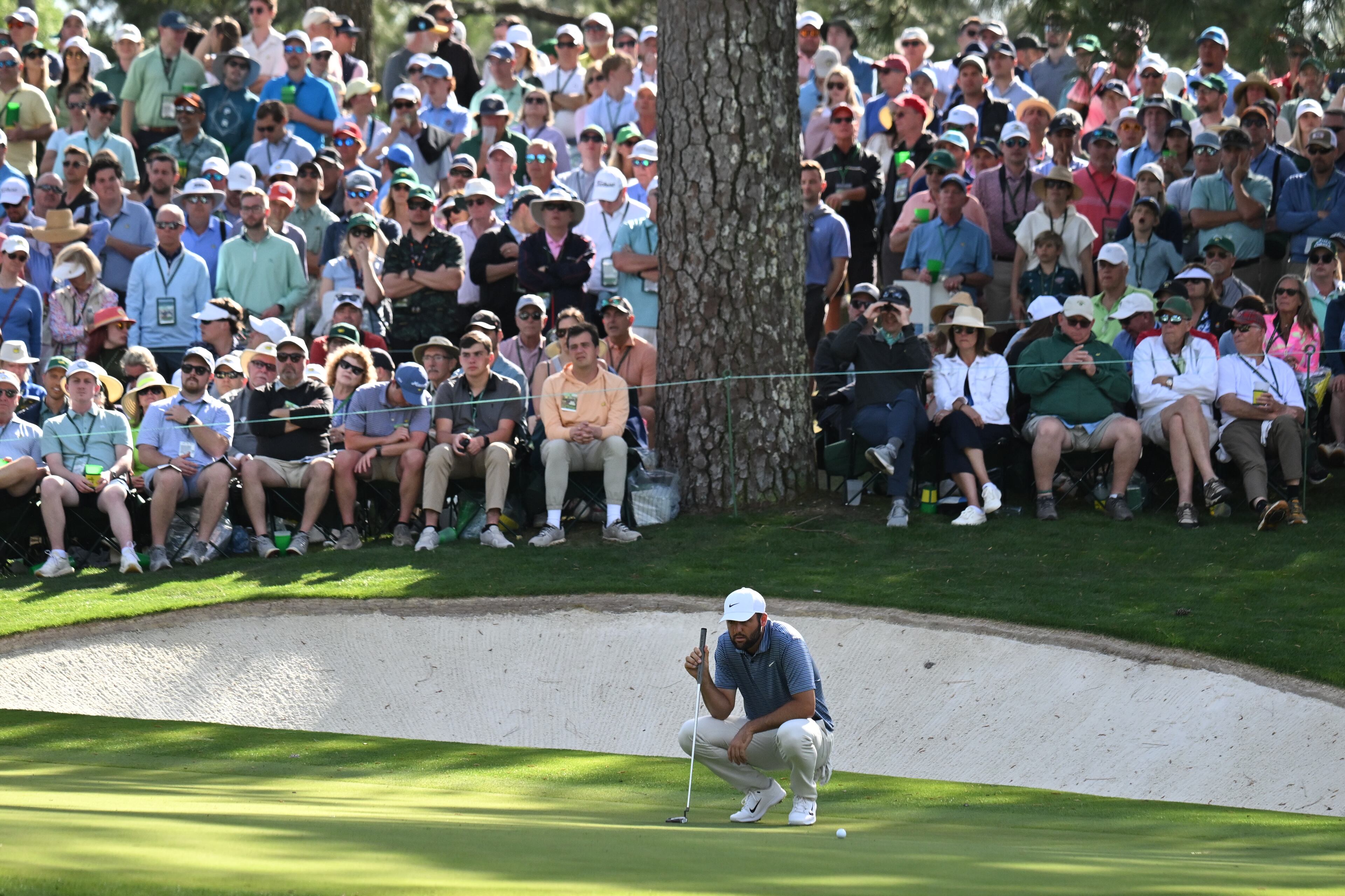 Scottie Scheffler lines up putt on 10th green during second round of the 2024 Masters Tournament at Augusta National Golf Club, Friday, April 12, 2024, in Augusta, Ga. (Hyosub Shin / Hyosub.Shin@ajc.com)