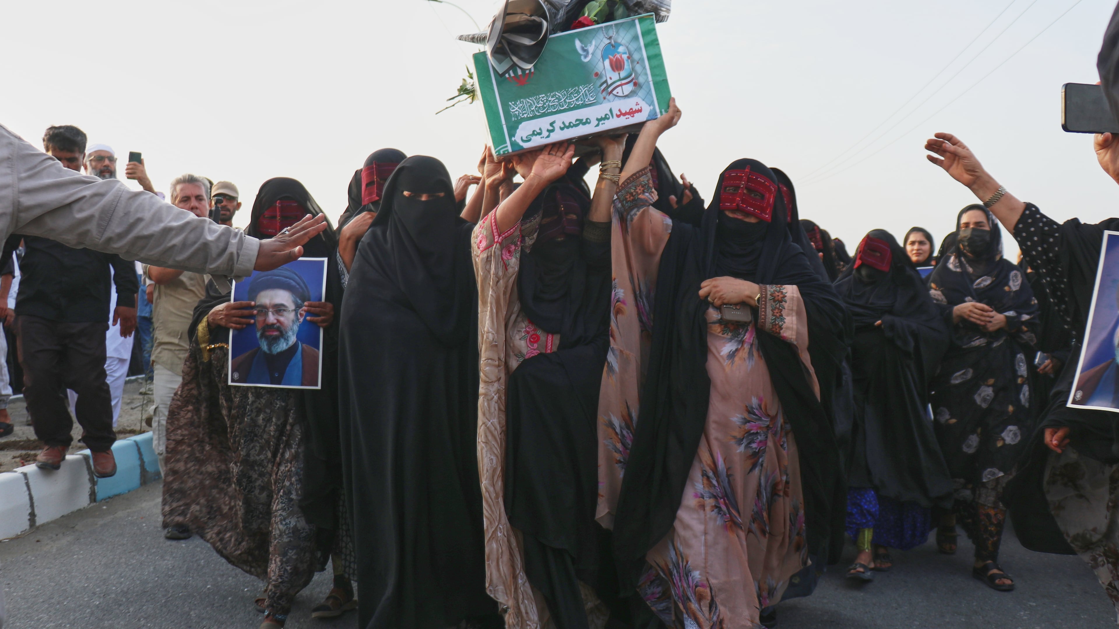 Women carry a coffin during a mass funeral for people killed when, according to Iranian media and a rights group, a U.S. missile struck a home where a wedding was being held in Kuhestak, southern Iran, Thursday, Sept. 3, 2026. (Razieh Poudat/ISNA via AP)