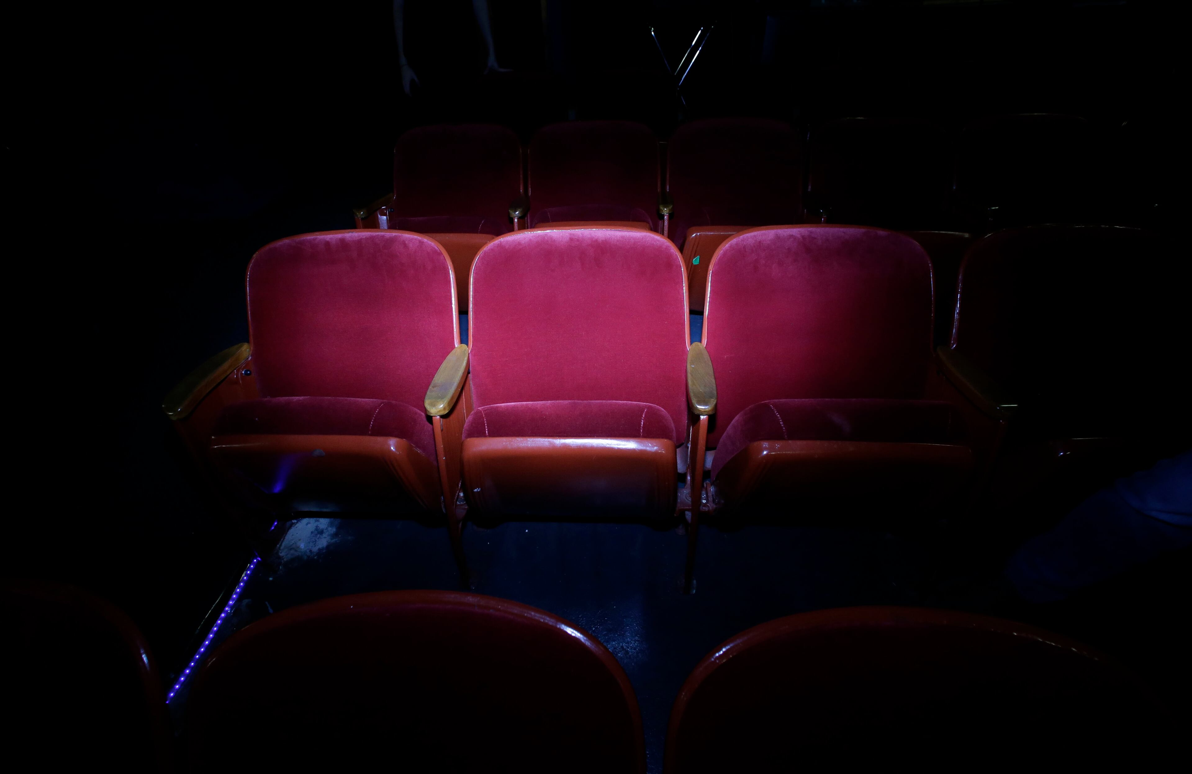 In this photo made in 2013, the seat that Lee Harvey Oswald was sitting in when Dallas Police arrested him is illuminated at the Texas Theater in the Oak Cliff section of Dallas. Oswald was arrested here on Nov. 22, 1963, after the assassination of President John F. Kennedy. (AP Photo/LM Otero)