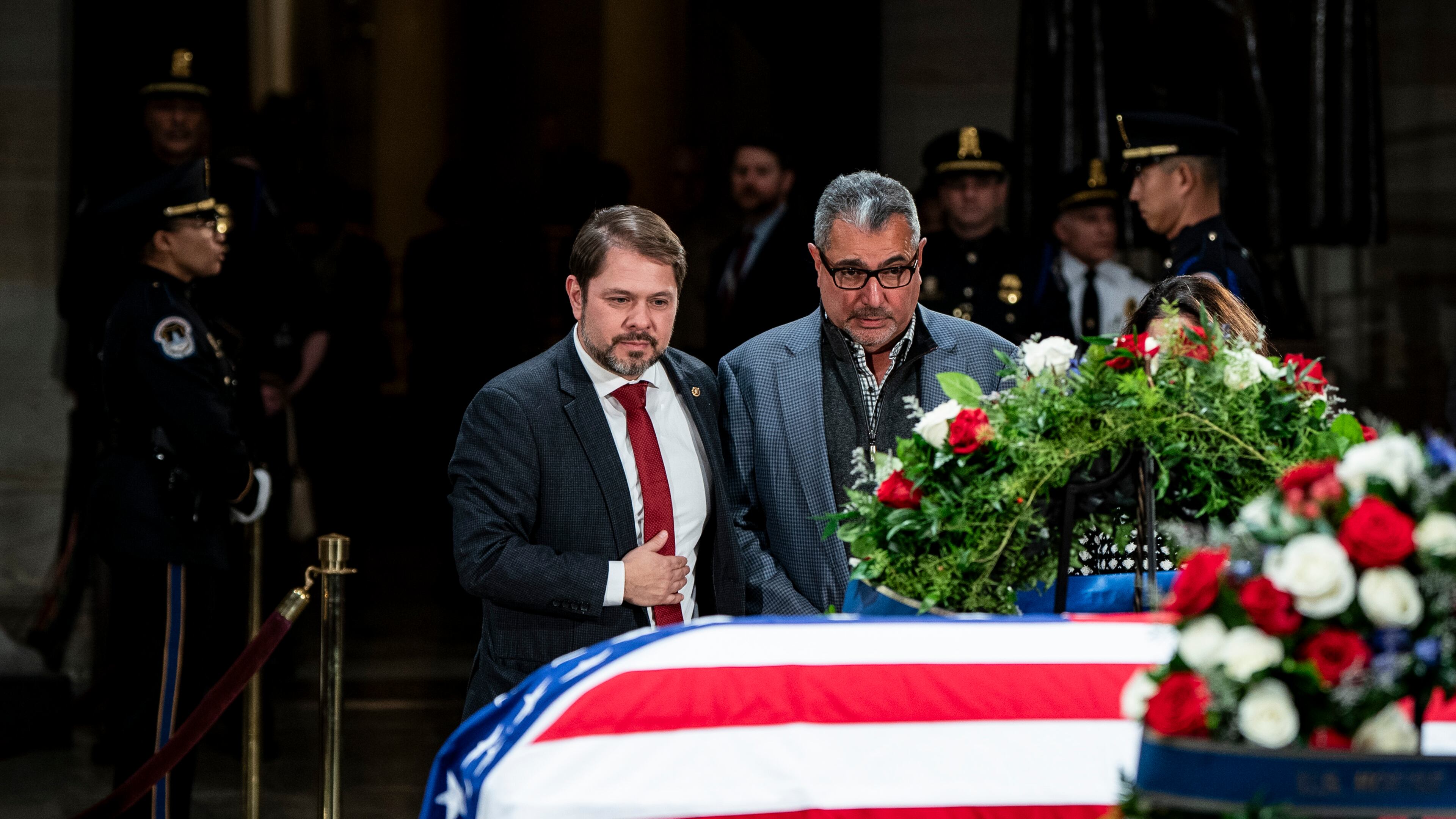 Sen. Ruben Gallego (D-Ariz.), left, pays respects to former President Jimmy Carter as Carter lies in state in the Rotunda of the Capitol in Washington, on Wednesday, Jan. 8, 2025. Gallego is one of seven Hispanic senators in Congress. (Haiyun Jiang/The New York Times)
