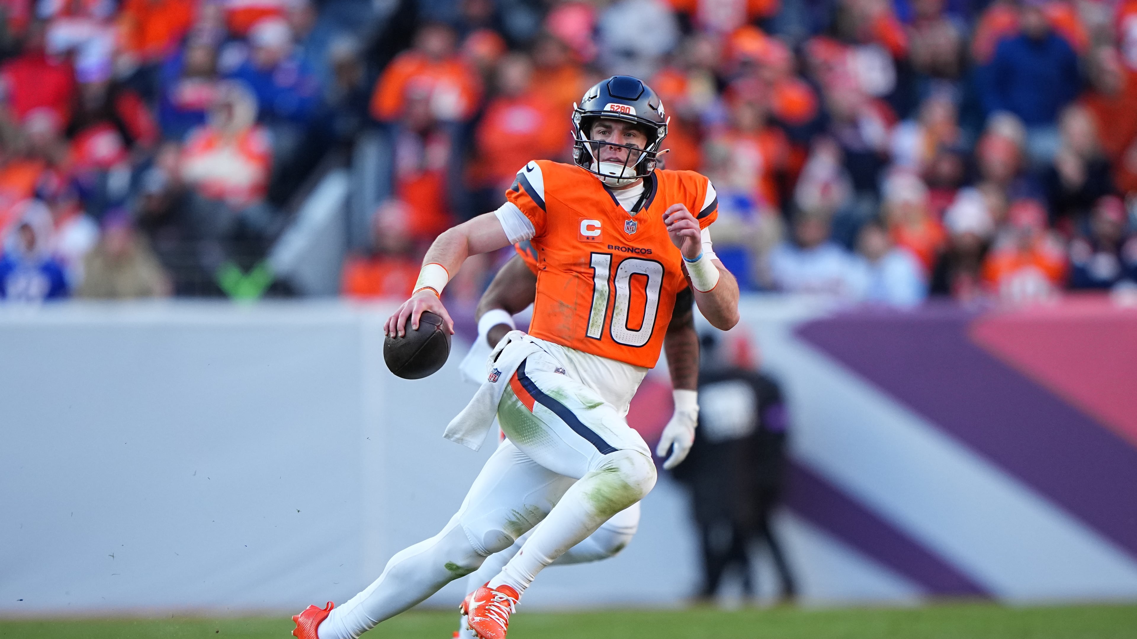 FILE - Denver Broncos quarterback Bo Nix (10) runs the ball against the Buffalo Bills in an NFL divisional playoff football game on Jan. 17, 2026 in Denver. (AP Photo/Bart Young, File)