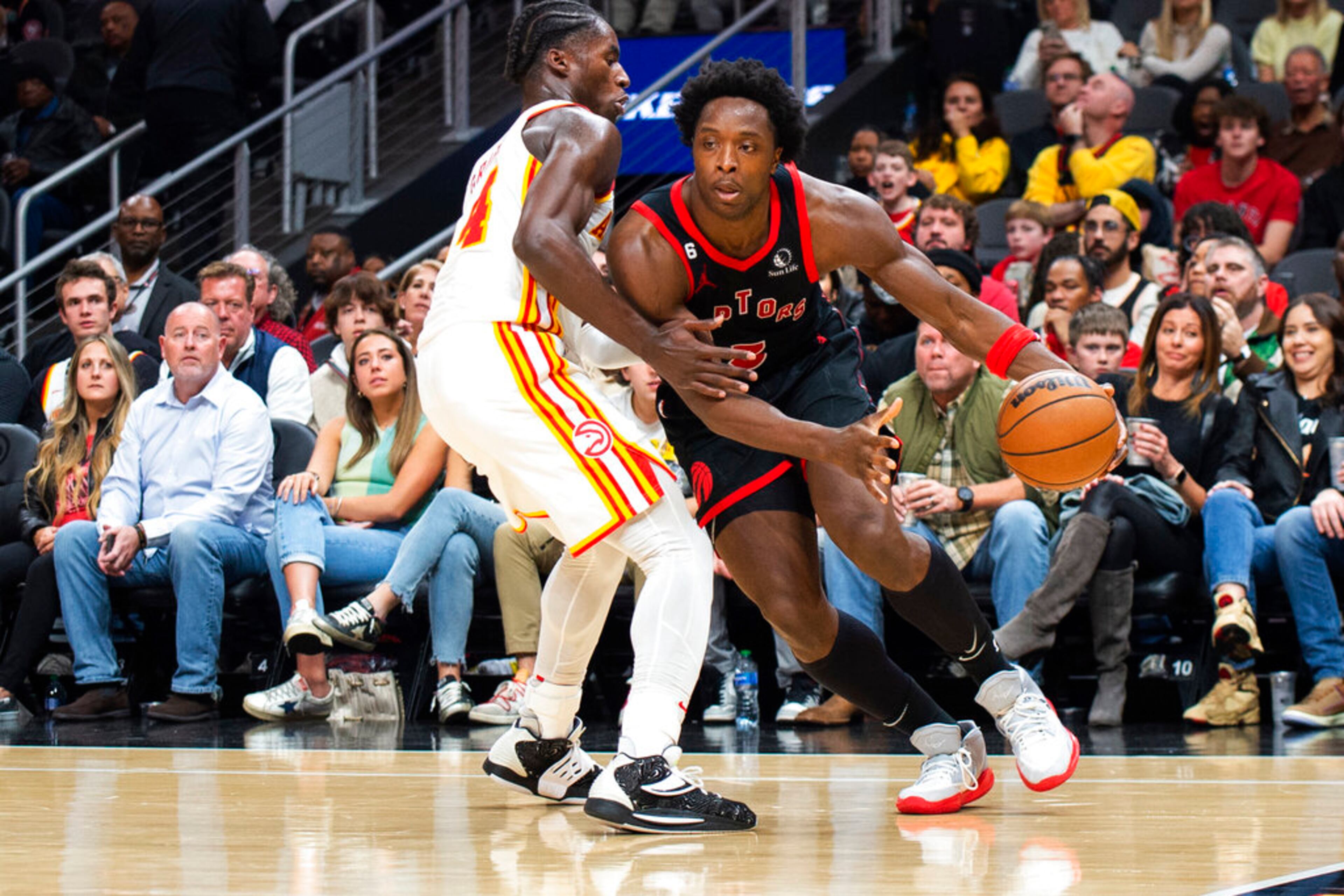 Toronto Raptors forward O.G. Anunoby dribbles to the basket against Atlanta Hawks forward AJ Griffin during the second half of an NBA basketball game, Saturday, Nov. 19, 2022, in Atlanta. (AP Photo/Hakim Wright Sr.)