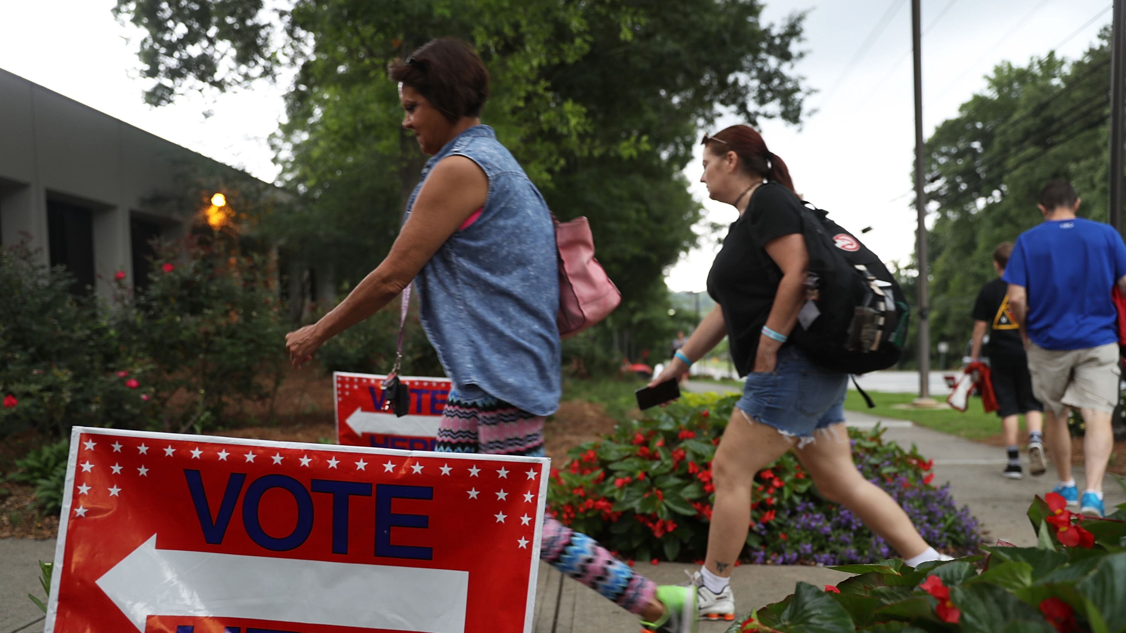 Voters walk to a polling place as ballots are cast during a special election in Georgia's 6th Congressional District at North Fulton Government Service Center on June 20, 2017 in Sandy Springs, Georgia. (Photo by Joe Raedle/Getty Images)