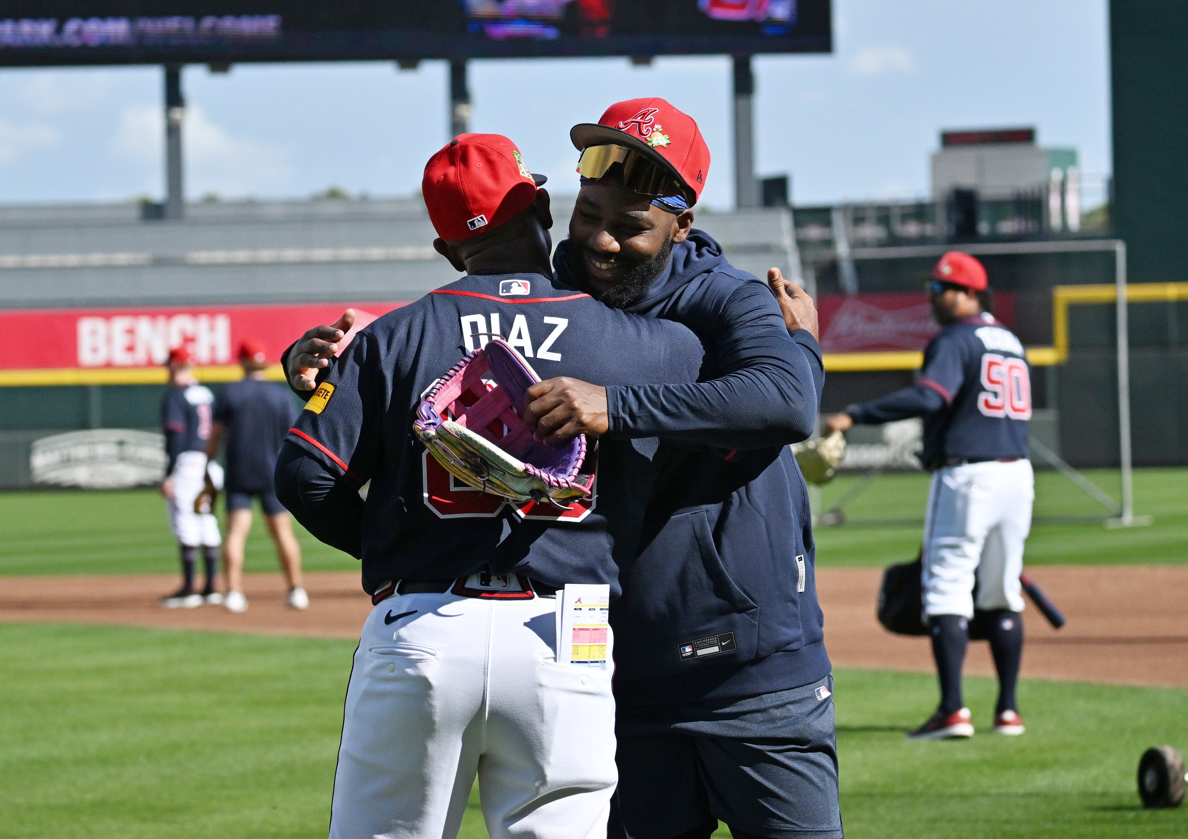 Braves center fielder Michael Harris II (right) is greeted by coach Tony Diaz during spring training workouts Wednesday, Feb. 11, 2026, at CoolToday Park in North Port, Fla. (Hyosub Shin/AJC)