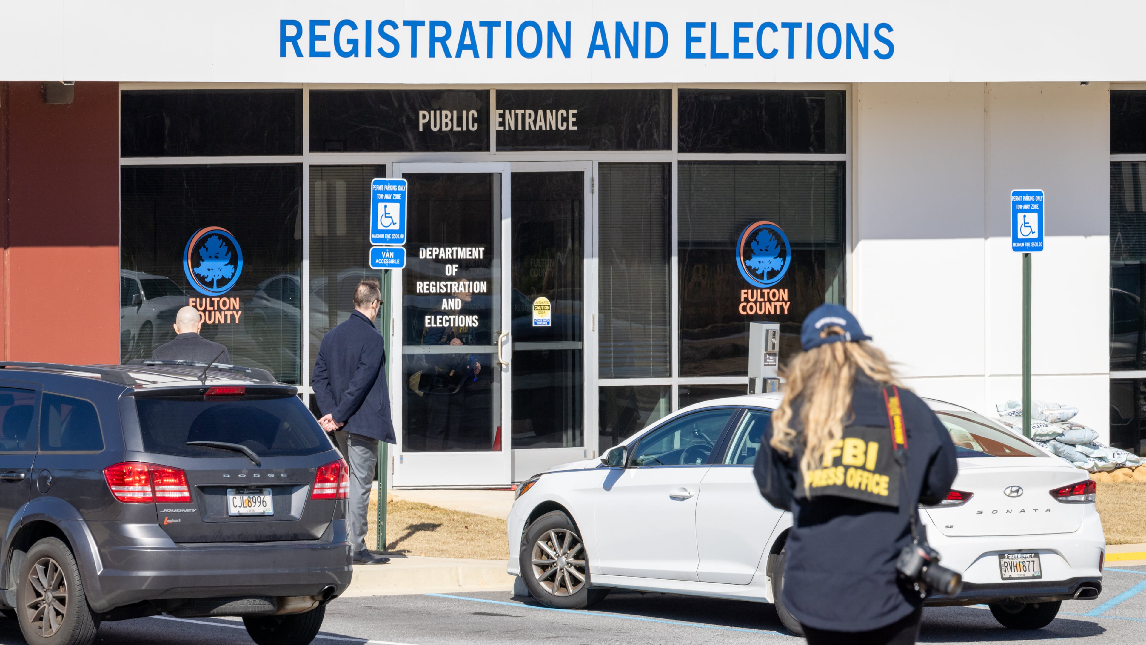 FBI public affairs officer Jenna Sellitto approaches the Fulton County Election Hub and Operation Center in Union City on Wednesday, Jan. 28, 2026. (Arvin Temkar/AJC)