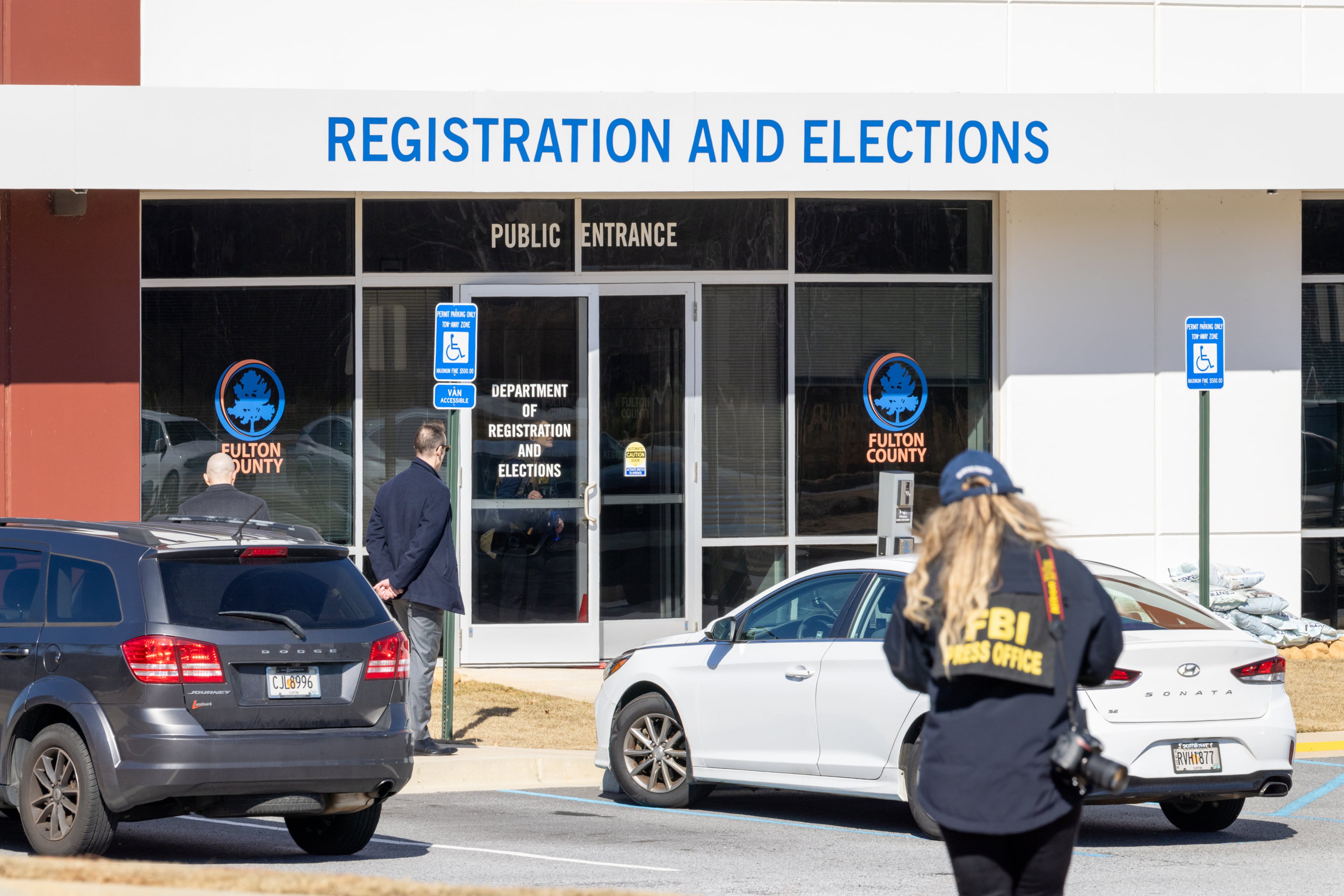 FBI public affairs officer Jenna Sellitto approaches the Fulton County Election Hub and Operation Center in Union City on Wednesday, Jan. 28, 2026. (Arvin Temkar/AJC)