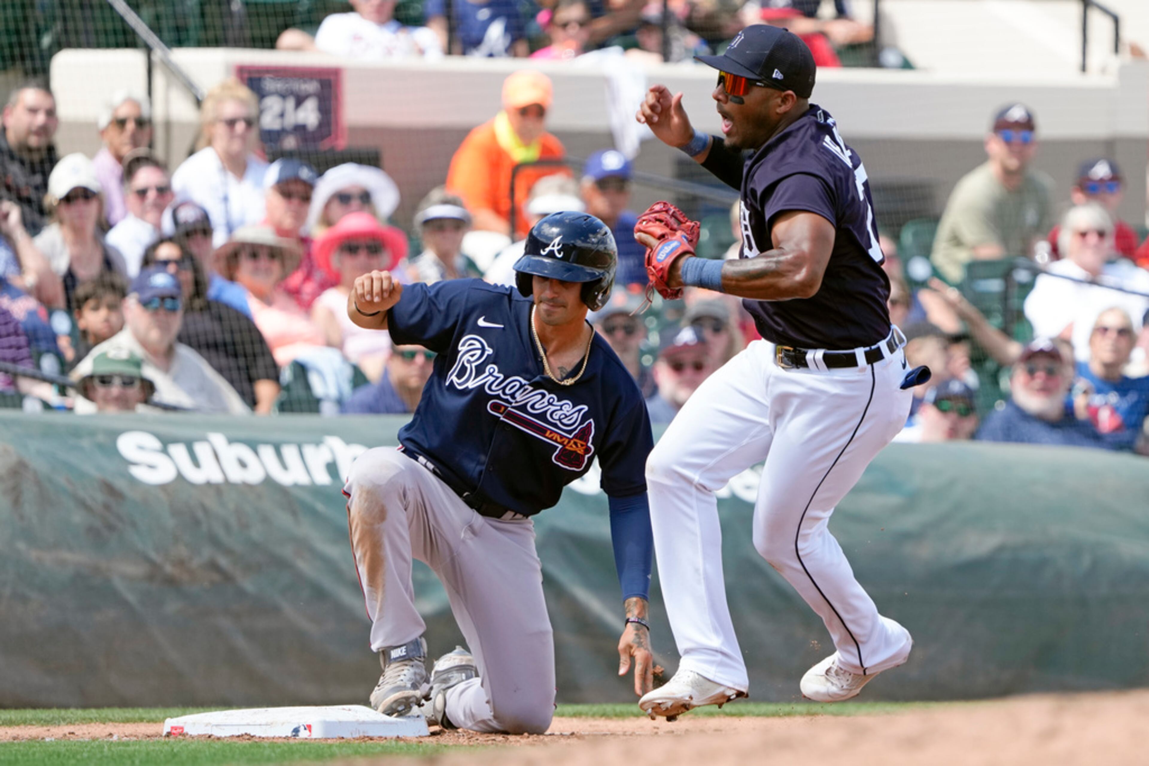 Detroit Tigers third baseman Andy Ibanez reacts after Atlanta Braves' Joshua Fuentes was ruled safe at third after a tag during the fourth inning of a spring training baseball game, Wednesday, March 22, 2023, in Lakeland, Fla. (AP Photo/John Raoux)