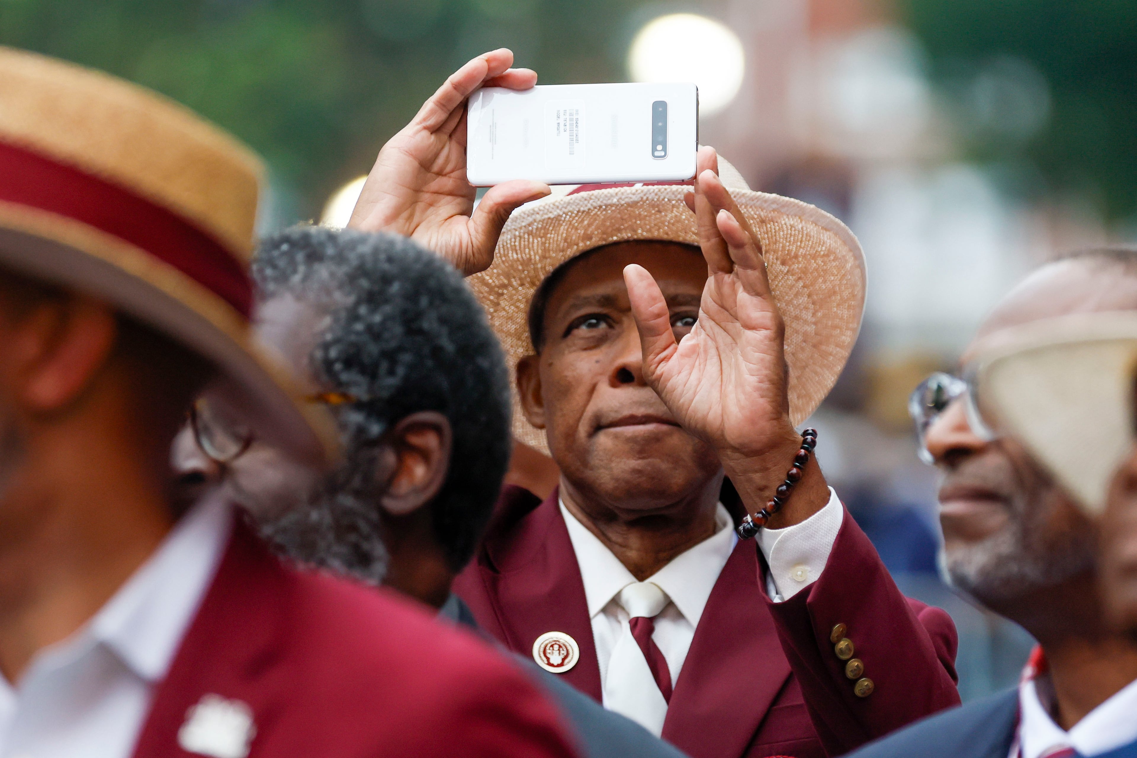 An alumnus records with his cellphone at the beginning of Morehouse College’s 141st Commencement Ceremony on Sunday, May 18, 2025.
(Miguel Martinez/ AJC)