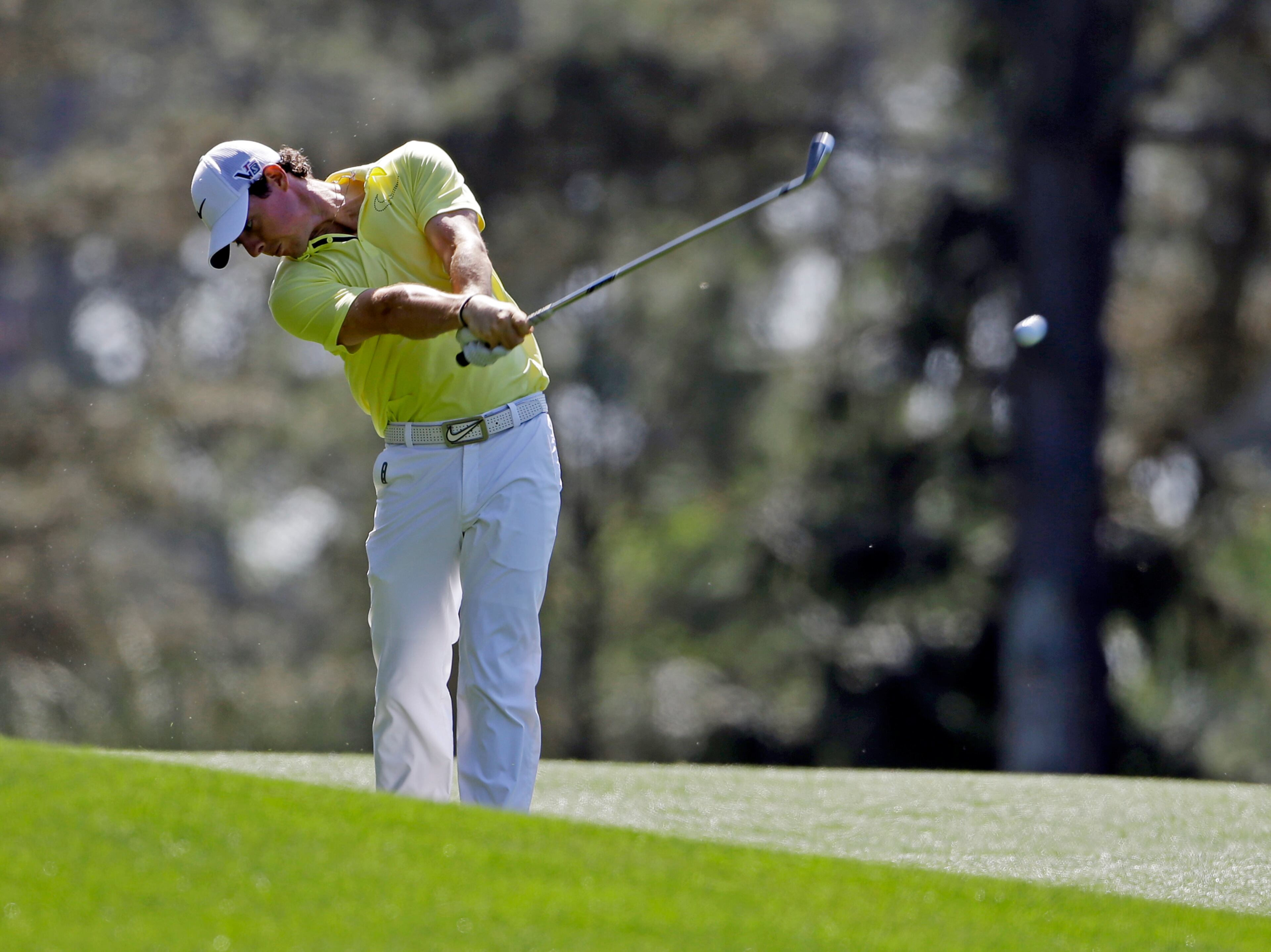 Rory McIlroy, of Northern Ireland, hits off the 15th fairway during a practice round for the Masters golf tournament April 10 in Augusta.