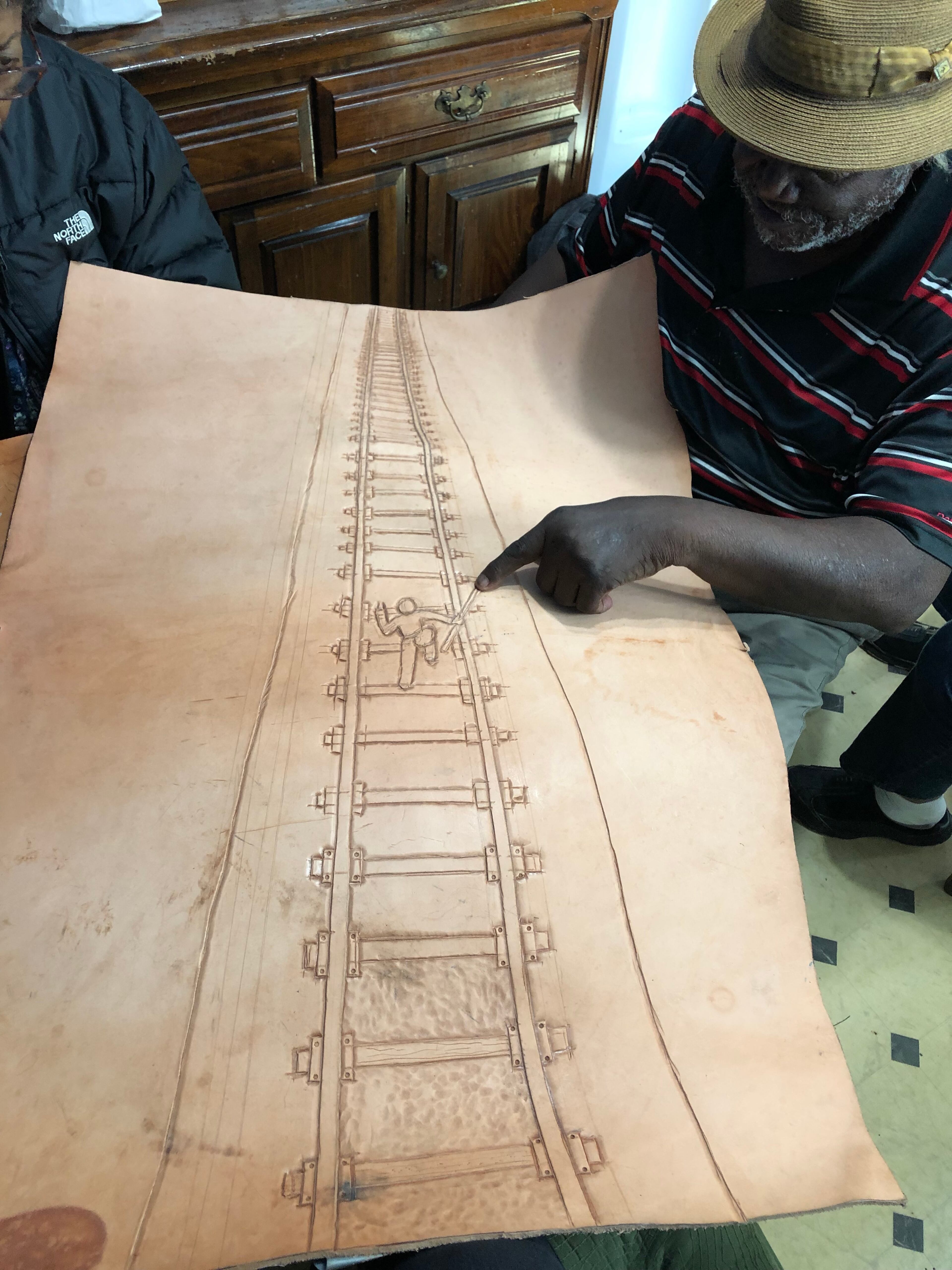 Winfred Rembert with one of his pieces in progress.