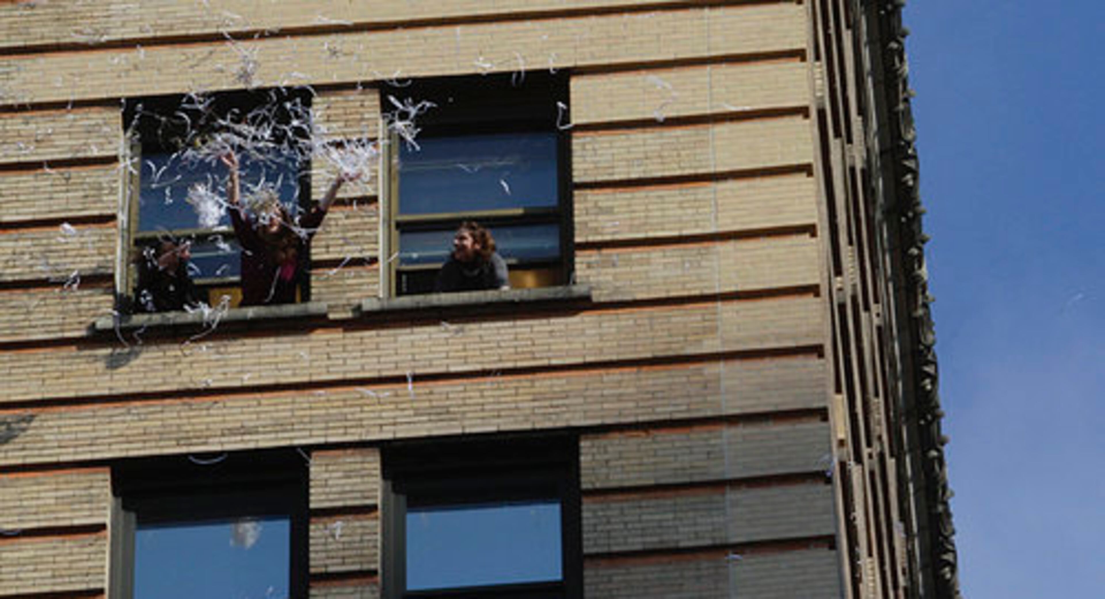Fans pour confetti from a hi-rise before the start of the New York Giants Super Bowl parade in New York, Tuesday, Feb. 7, 2012. Eli Manning and the New York Giants are Super Bowl champions again. Just as they did four years ago in Arizona, Tom Coughlin's Giants have defeated Bill Belichick's New England Patriots, this time 21-17 in Indianapolis for their fourth Lombardi Trophy.