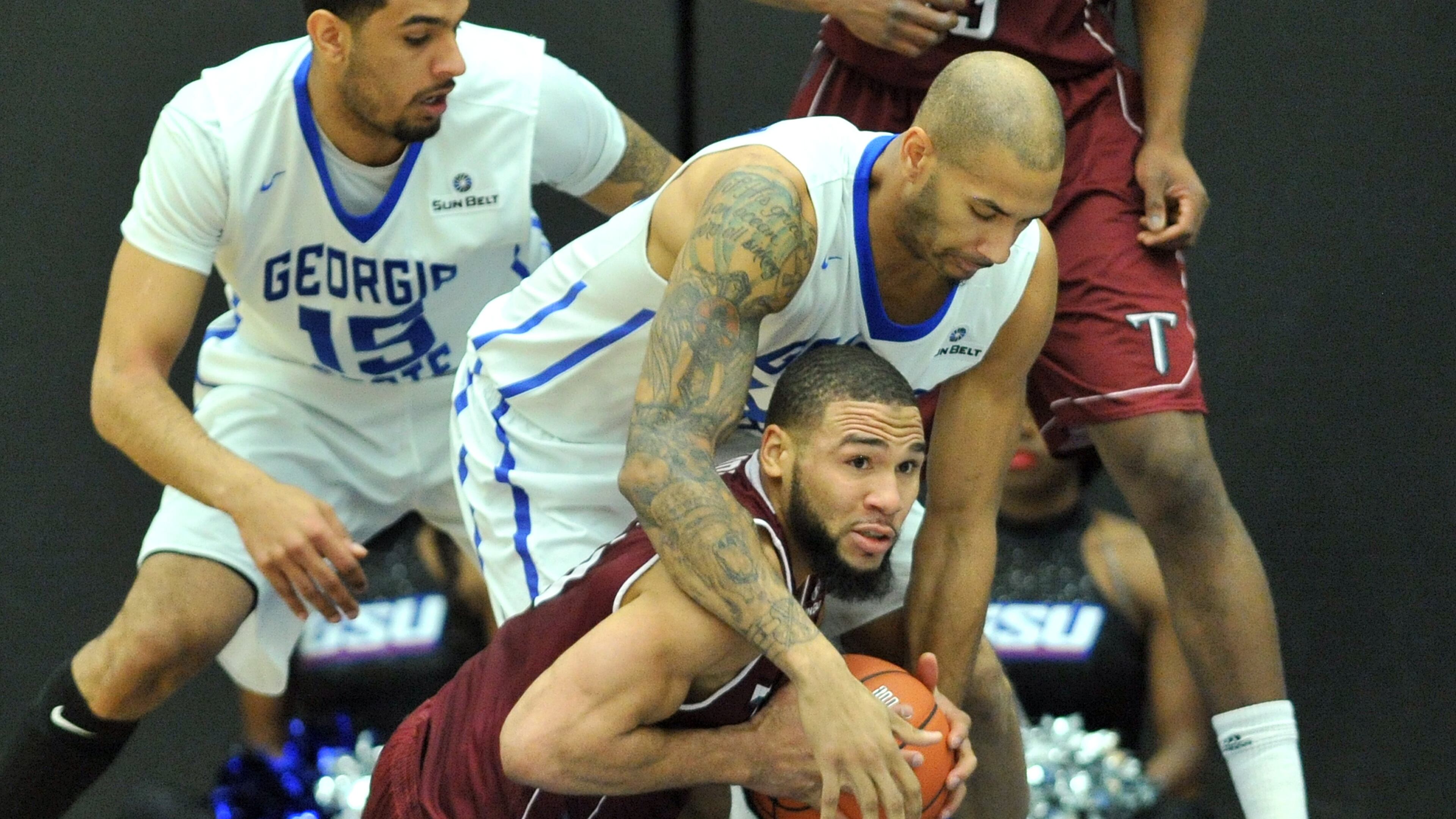 Georgia State Panthers forward Curtis Washington (42) tries to steal a ball from Troy Trojans guard Musa Abdul-Aleem (1) in the first half of their NCAA college basketball game at the GSU Arena on Saturday, January 10, 2015. HYOSUB SHIN / HSHIN@AJC.COM