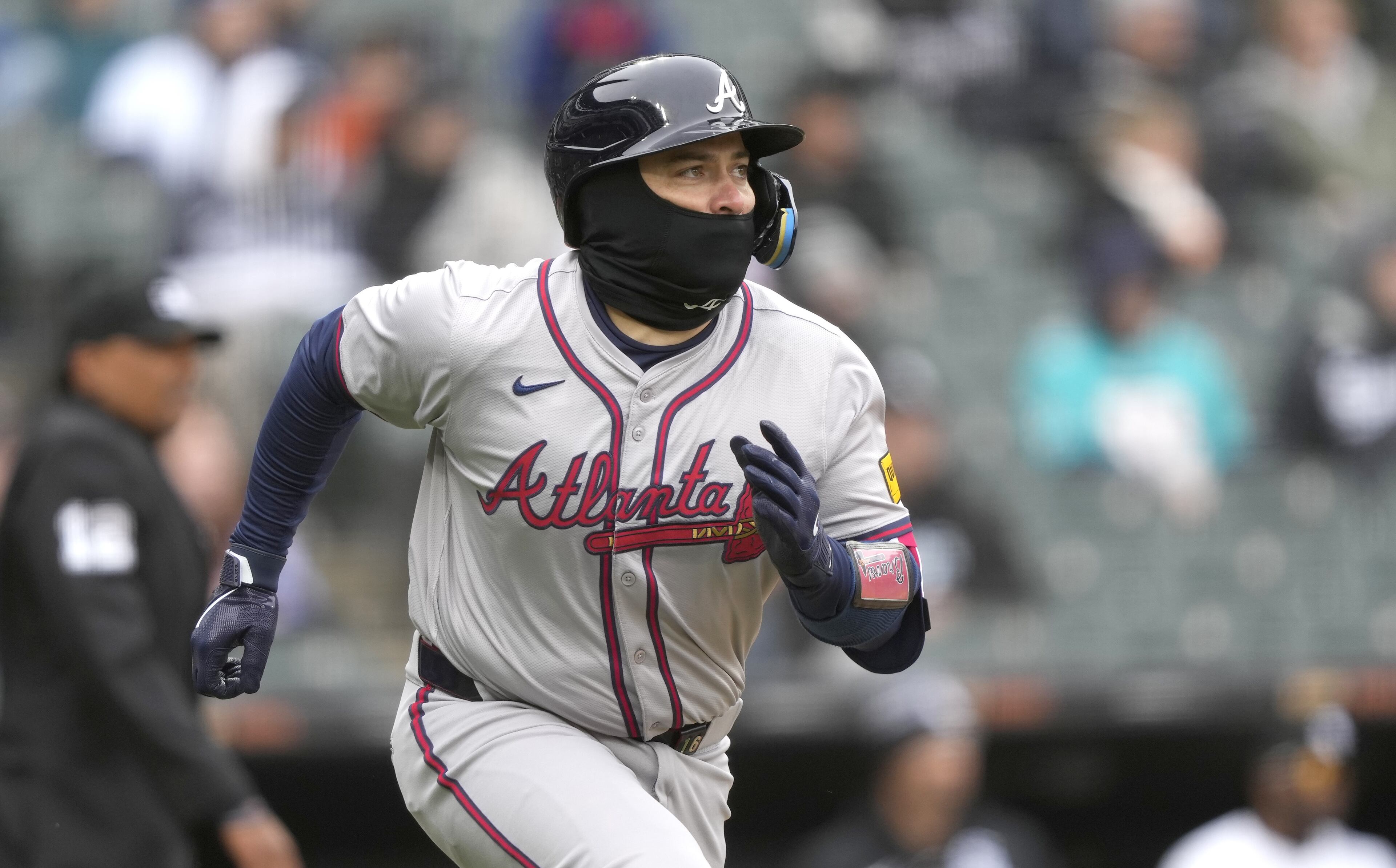 Travis d'Arnaud follows the flight of the ball after connecting for what would eventually become a double during Monday's Braves-White Sox game in Chicago.