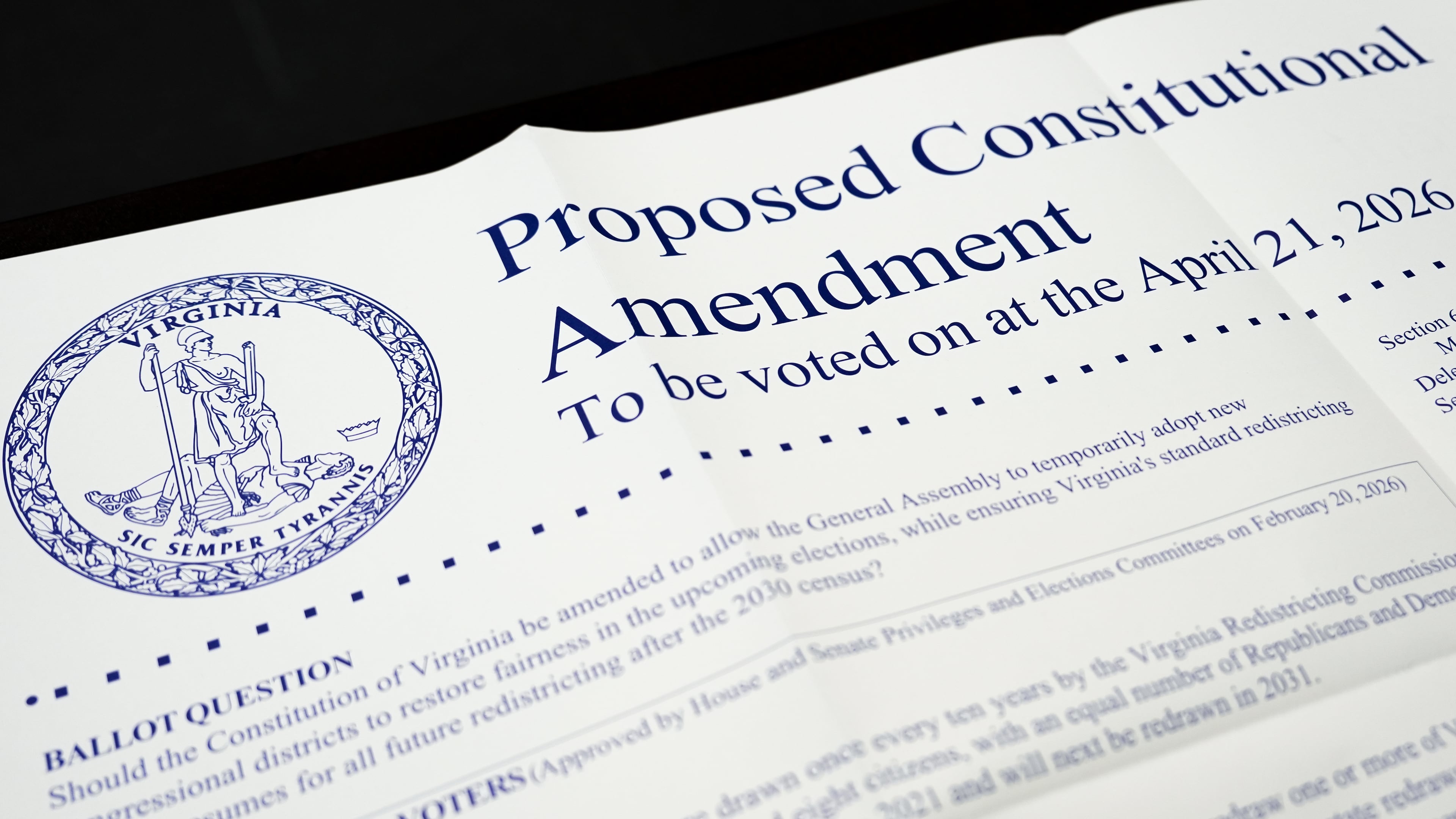 A poster on the Virginia redistricting referendum is seen during voting at Mason Square, Tuesday, April 21, 2026, in Alexandria, Va. (AP Photo/Julia Demaree Nikhinson)