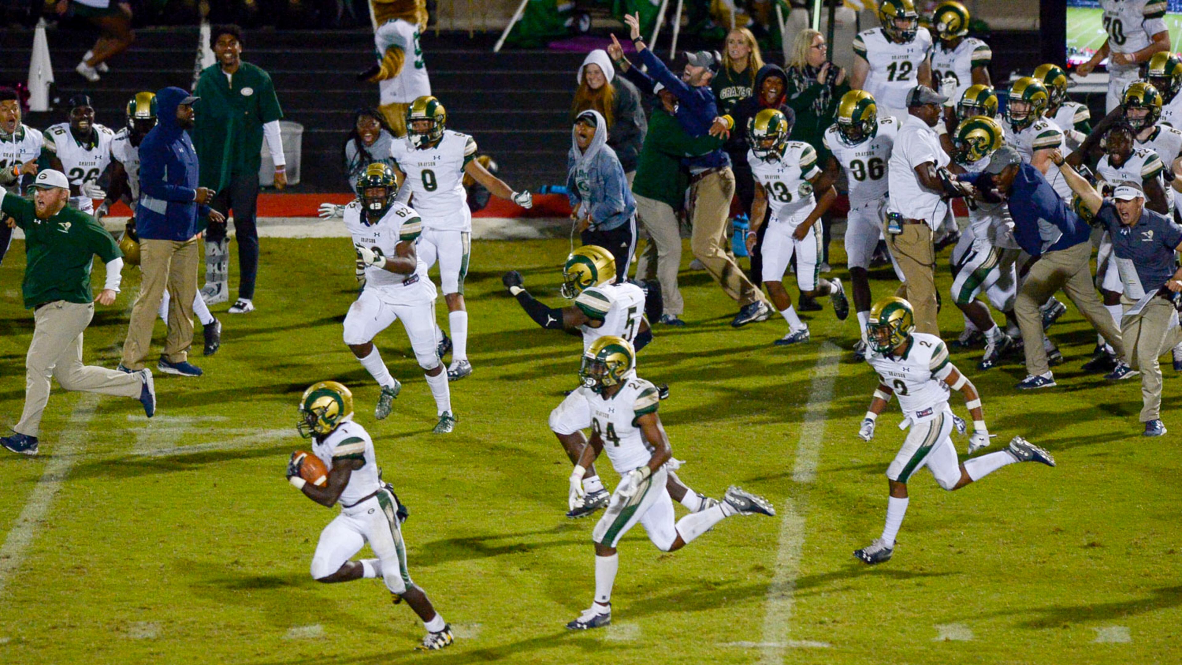 Victory, Victory!! The Grayson Rams storm the field after defeating the Archer Tigers in overtime Friday in a battle of Gwinnett County teams. (Daniel Varnado/Special)