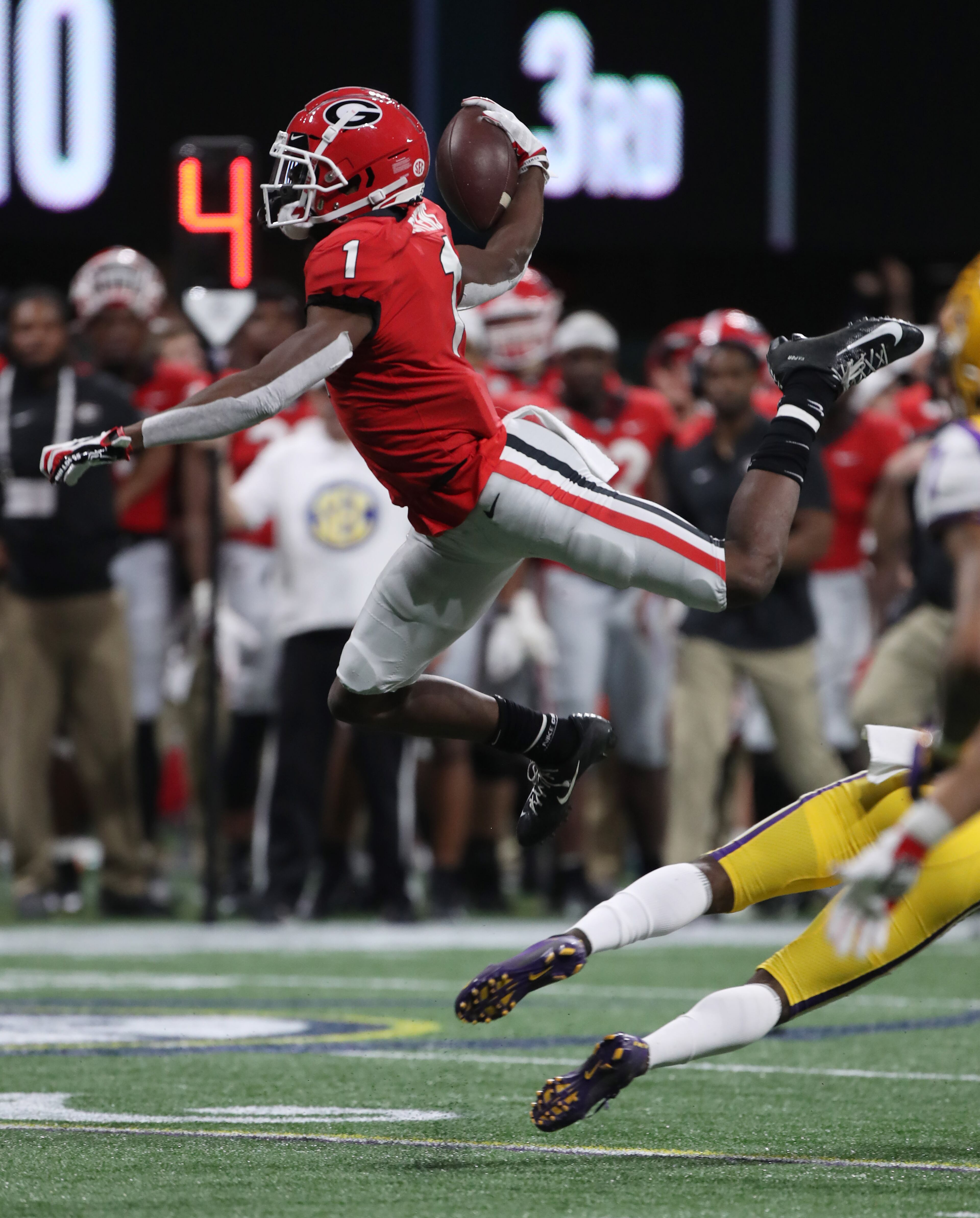 Georgia Bulldogs wide receiver George Pickens (1) makes a leap during the second half of the Georgia vs. LSU SEC Football Championship game at Mercedes-Benz Stadium in Atlanta. Alyssa Pointer / alyssa.pointer@ajc.com