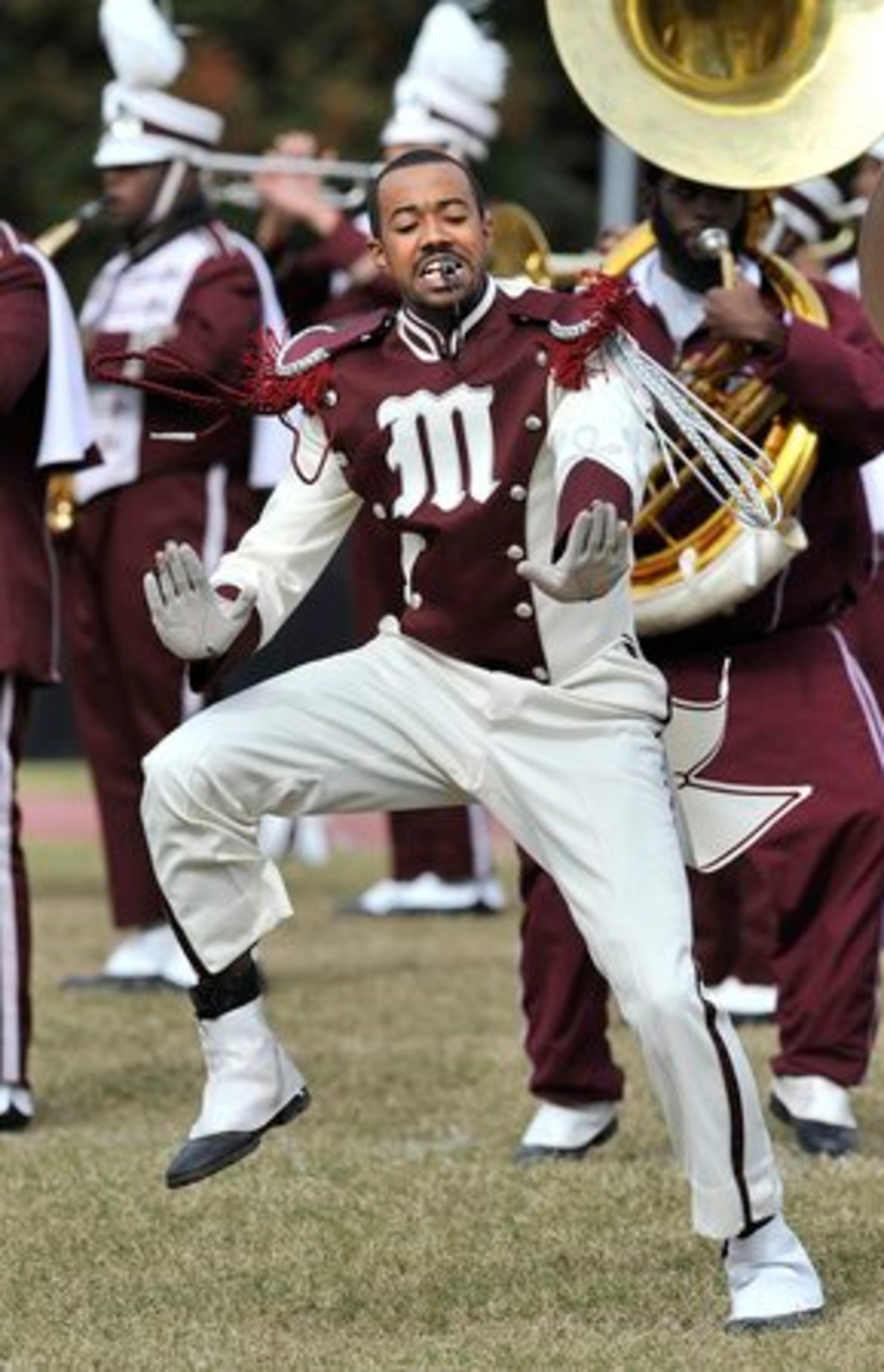 Morehouse College drum major Christopher Allison moves in step with the beat during the halftime performance.