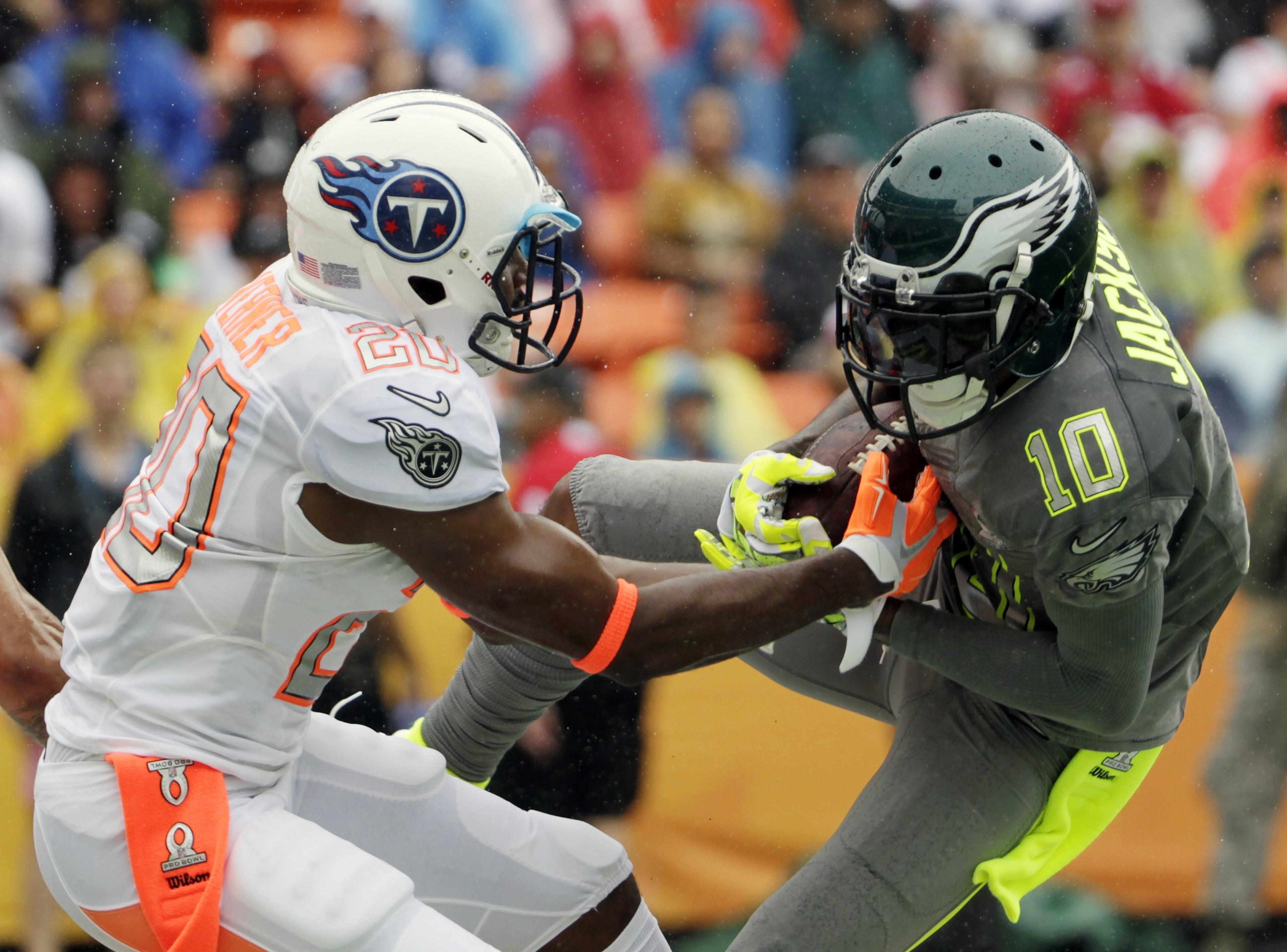 Philadelphia Eagles DeSean Jackson (10) of Team Sanders makes a catch for a touchdown in the first half as Tennessee Titans cornerback Alterraun Verner (20) of Team Rice attempts to break up the pass during the Pro Bowl, Sunday, Jan. 26, 2014, at Aloha Stadium in Honolulu. (AP Photo/Eugene Tanner)