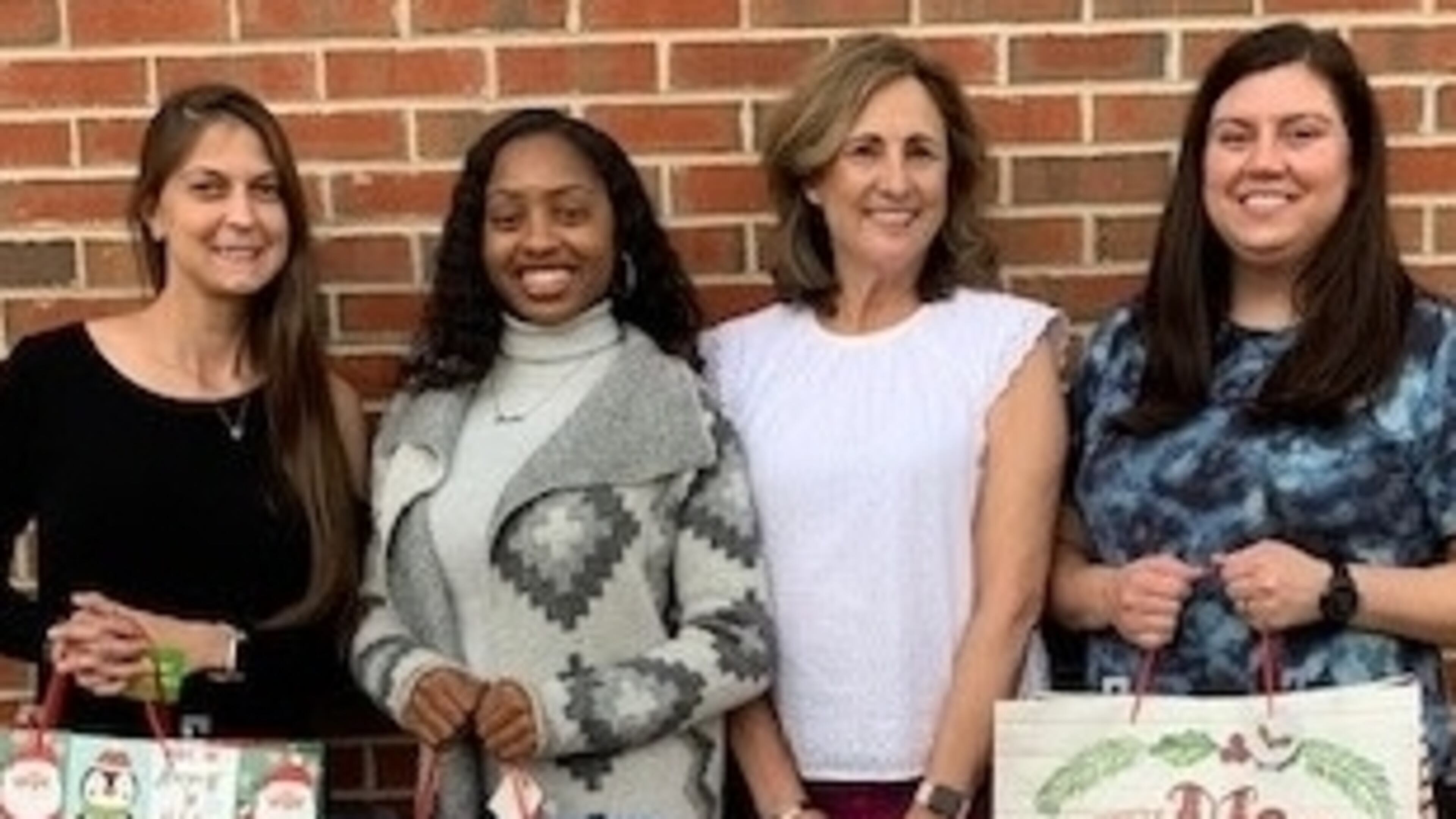 Adopt-A-Senior program is held each holiday season by the Cherokee County Senior Services. Donated gift bags are delivered to the CCSS clients. (Pictured: Leslie White, Jasmine McKinney, HDM Supervisor/Volunteer Coordinator Alice O Micham and Brittany Kiser.