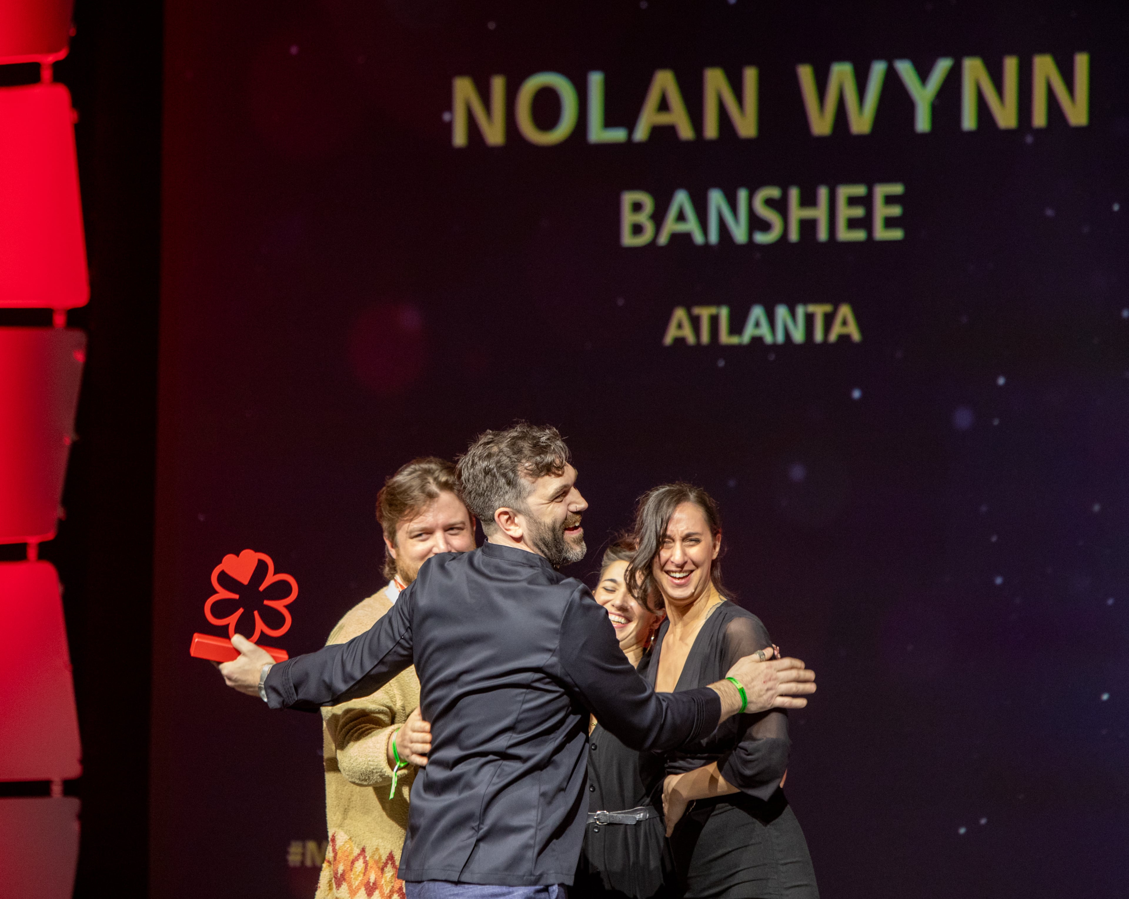 The Michelin Guide Awards take place at the Georgia World Congress Center on Monday, Oct 28, 2024 where Banshee’s Benjamin Park celebrates with the team before accepting the award on behalf of Nolan Wynn. (Jenni Girtman for The Atlanta Journal-Constitution)