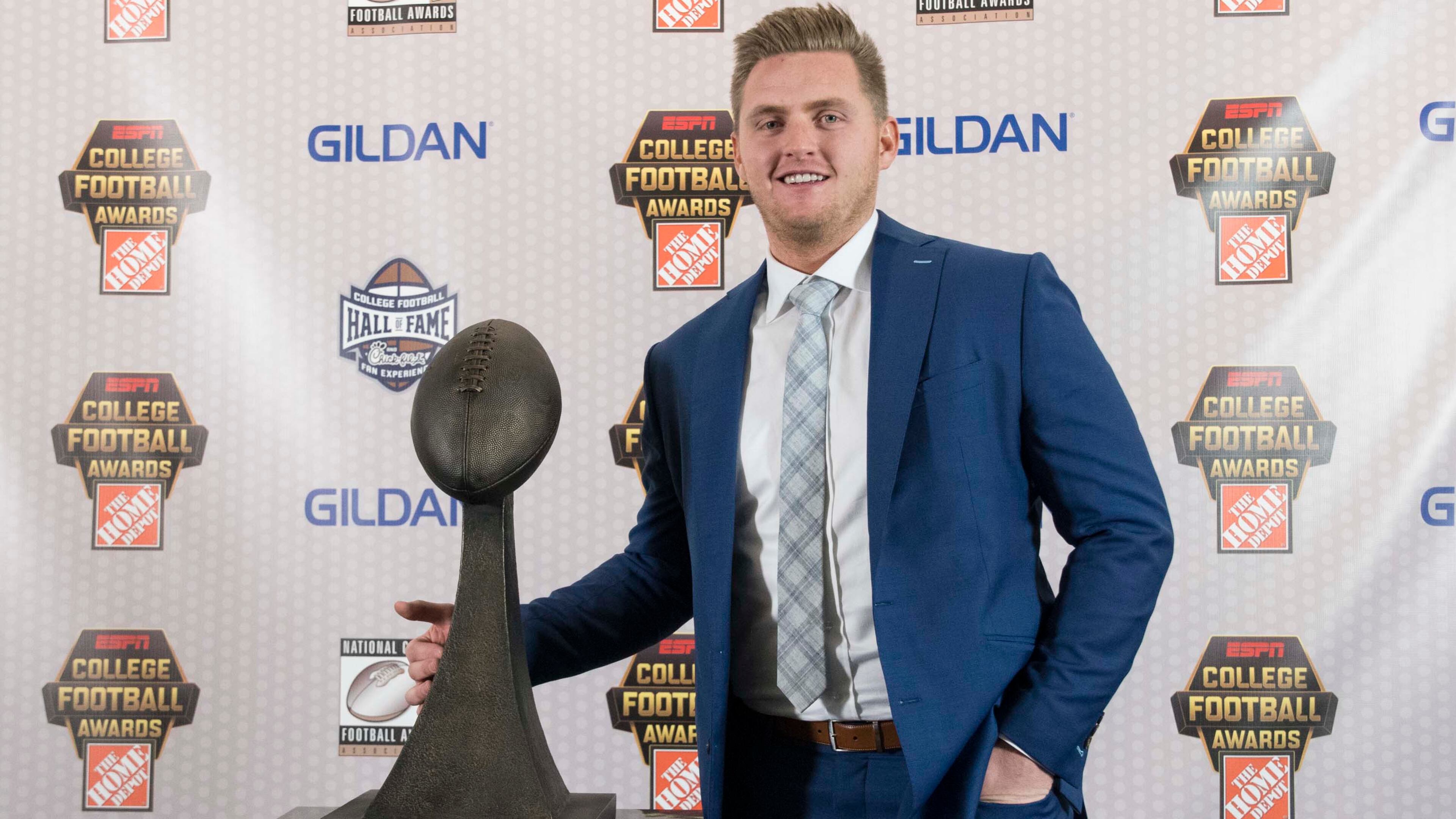 Utah's Matt Gay winner of the Lou Groza Collegiate Place-Kicker Award for most outstanding kicker stands with the trophy during the College Football Awards show at the College Football Hall of Fame, Thursday, Dec. 7, 2017, in Atlanta. (AP Photo/John Amis)