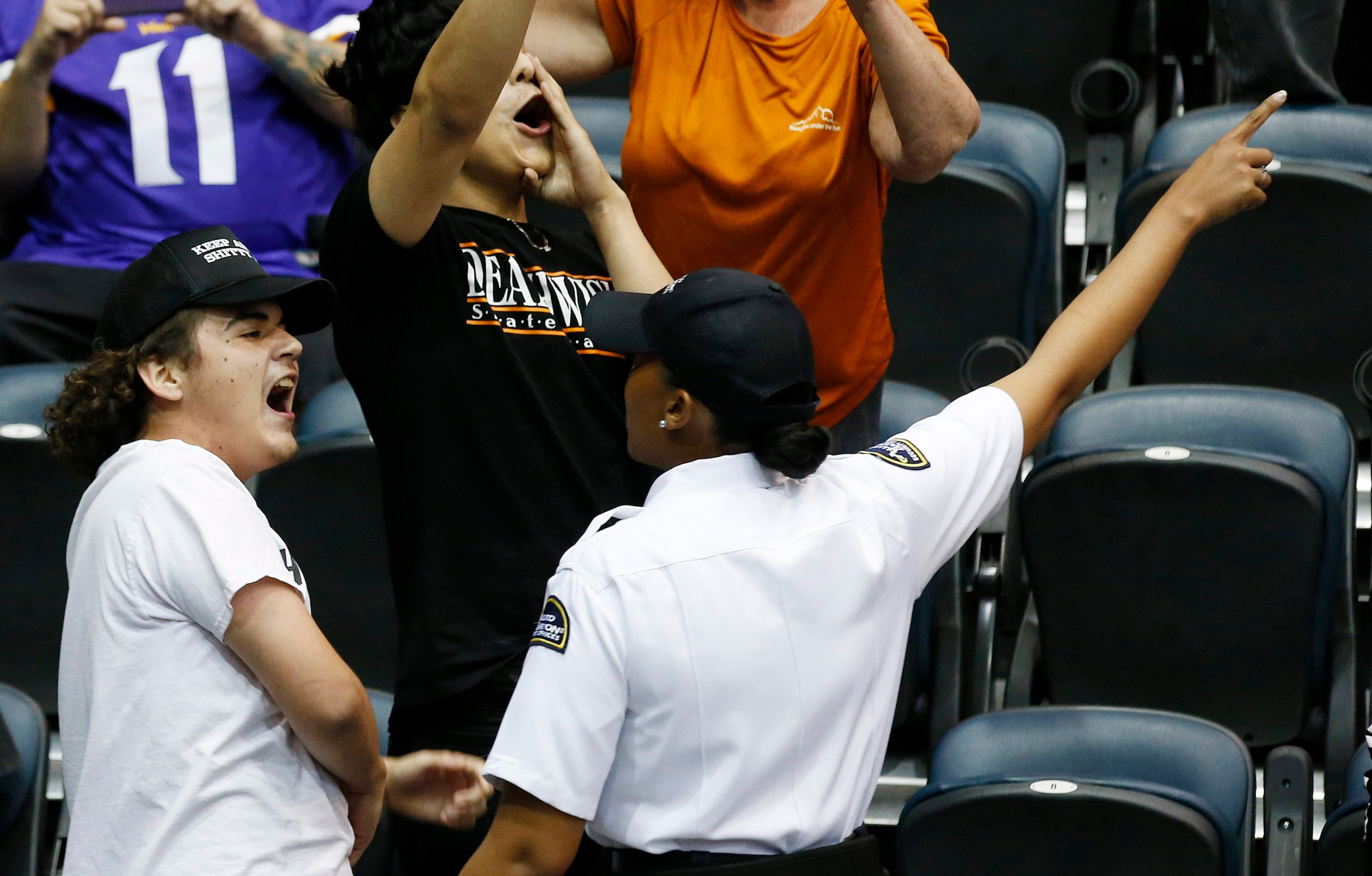 Security, right, tries to remove two protesters, left and top, from a rally where Republican presidential candidate Donald Trump was speaking Saturday, March 19, 2016, in Tucson, Ariz. (AP Photo/Ross D. Franklin)