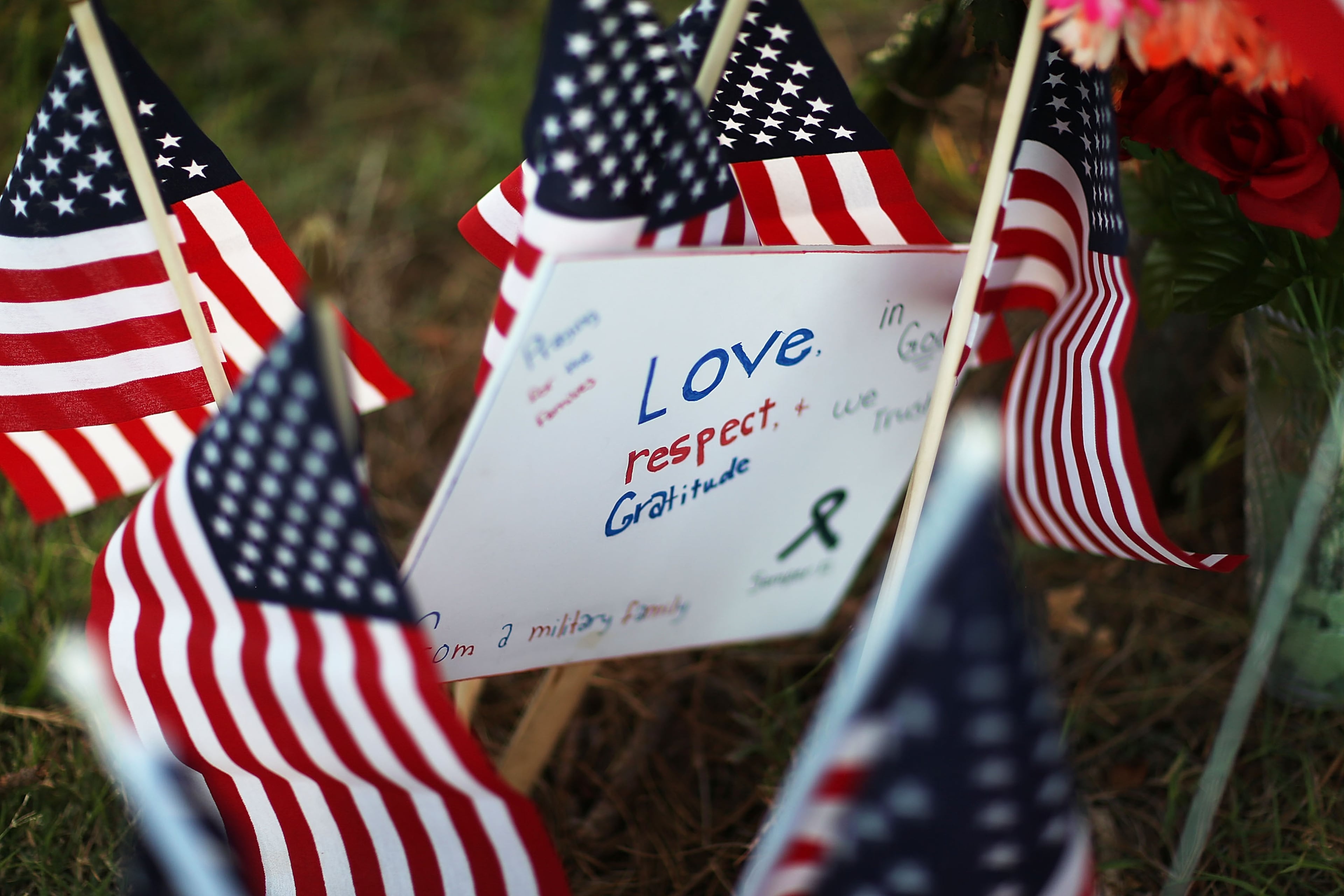 CHATTANOOGA, TN - JULY 18: A message is seen among the memorial setup in front of the Armed Forces Career Center/National Guard Recruitment Office on July 18, 2015 in Chattanooga, Tennessee. According to reports, Mohammod Youssuf Abdulazeez, 24, opened fire on the military recruiting station on July 16th at the strip mall and then drove to an operational support center operated by the U.S. Navy and killed four United States Marines there, more than seven miles away, (Photo by Joe Raedle/Getty Images)