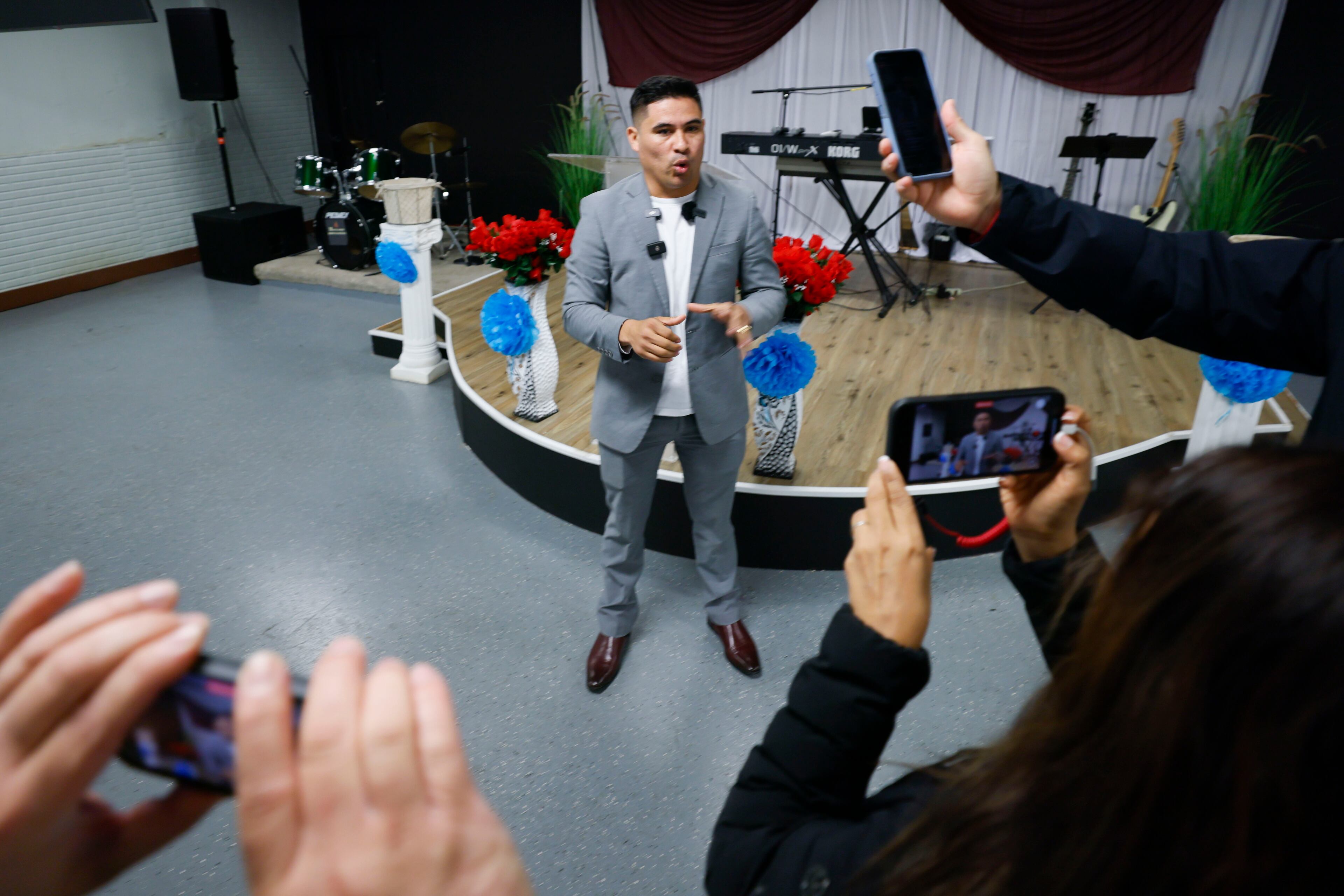 Pastor Luis Ortiz from Vision in Power Church in Tucker speaks to the news media about the arrest of a congregant at the church on Sunday.