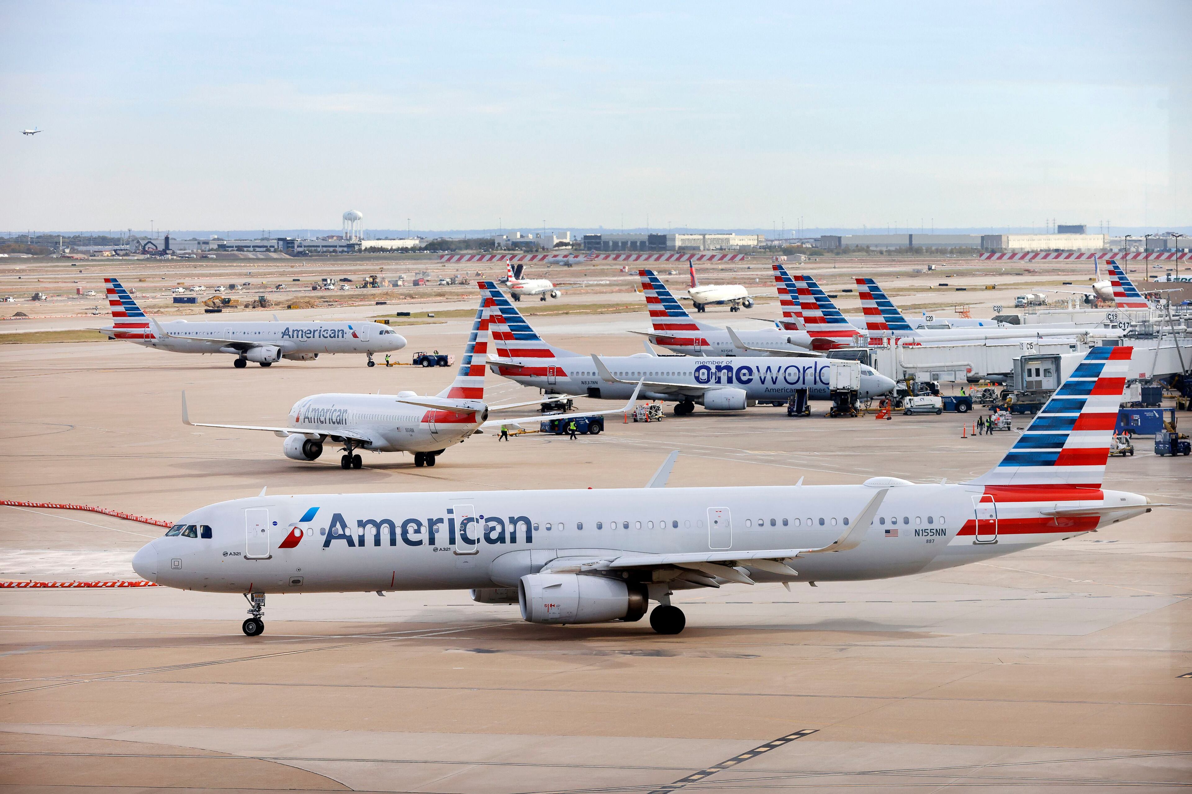 An American Airlines jet taxis to the runway after leaving a Terminal C gate at DFW Airport, Nov. 27, 2023. (Tom Fox/The Dallas Morning News/TNS)