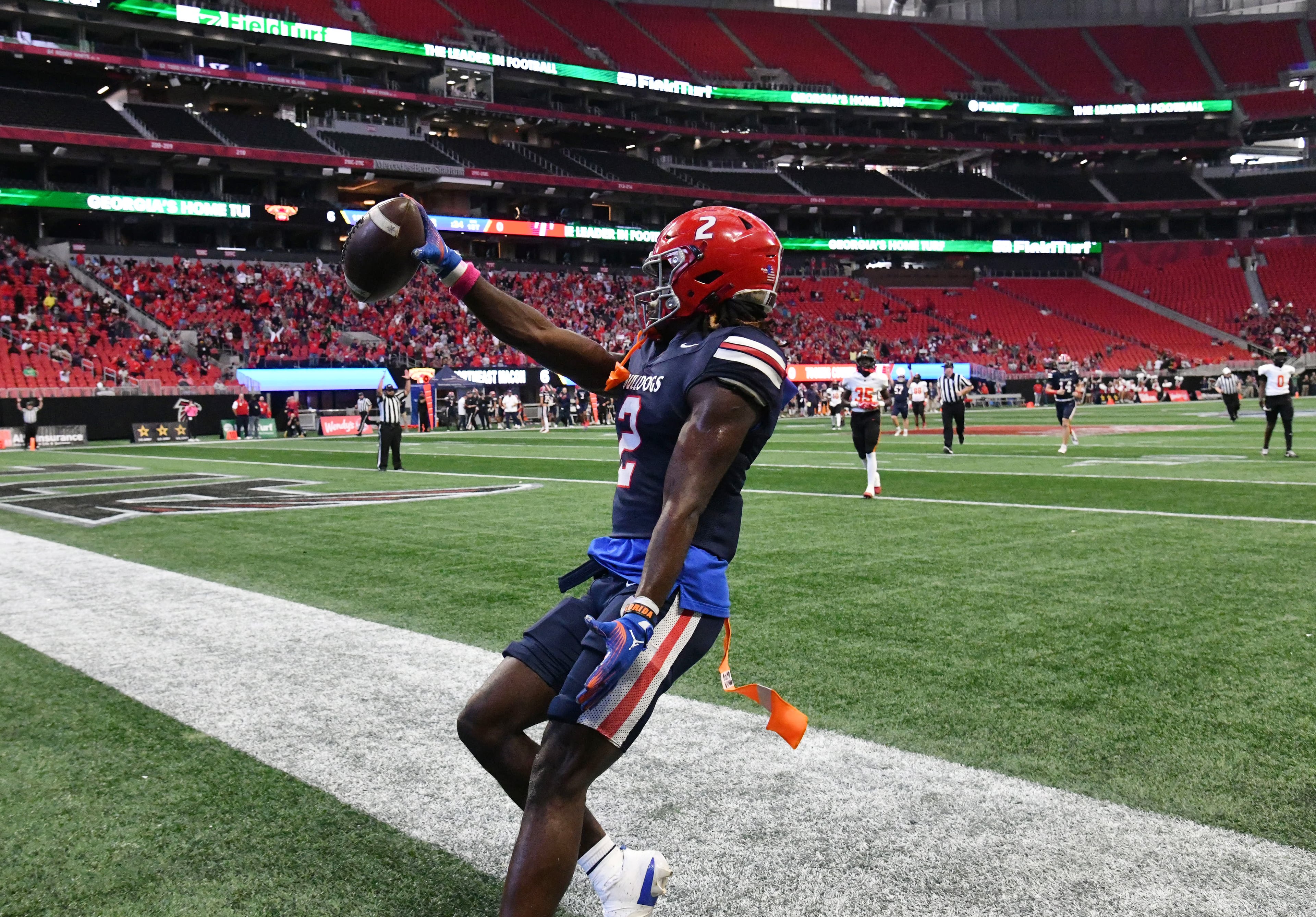 Toombs County's wide receiver Lagonza Hayward (2) scores a touchdown during the first half in GHSA Class A-Division State Championship game at Mercedes-Benz Stadium, Tuesday, December 17, 2024, in Atlanta. (Hyosub Shin / AJC)