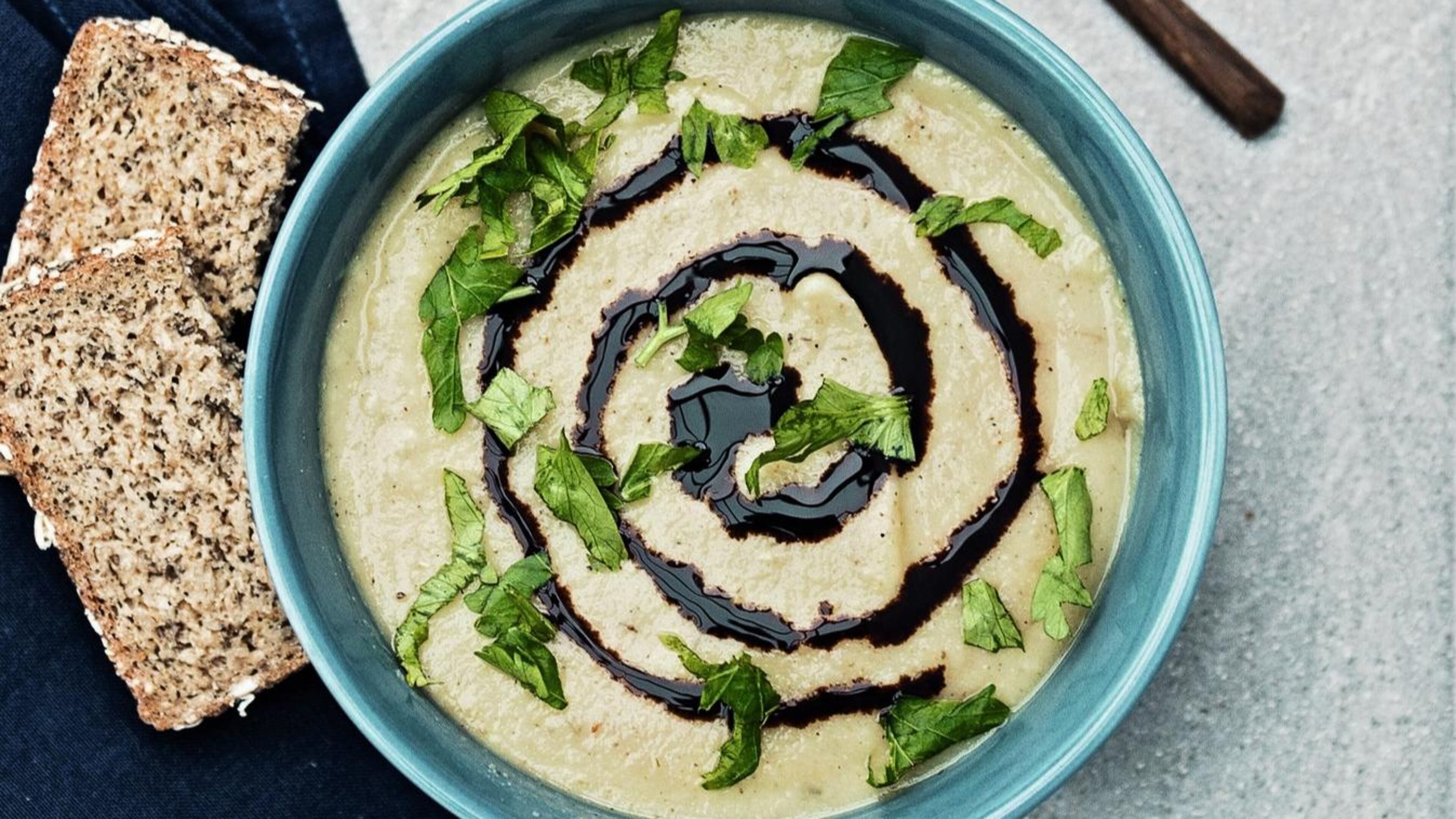 Here, Creamy Parsnip Pear Soup is finished with a swirl of a balsamic reduction and a sprinkle of fresh parsley. Reprinted with permission from “Awesome Vegan Soups” by Vanessa Croessmann, Page Street Publishing Co., 2019. CONTRIBUTED BY VANESSA CROESSMANN