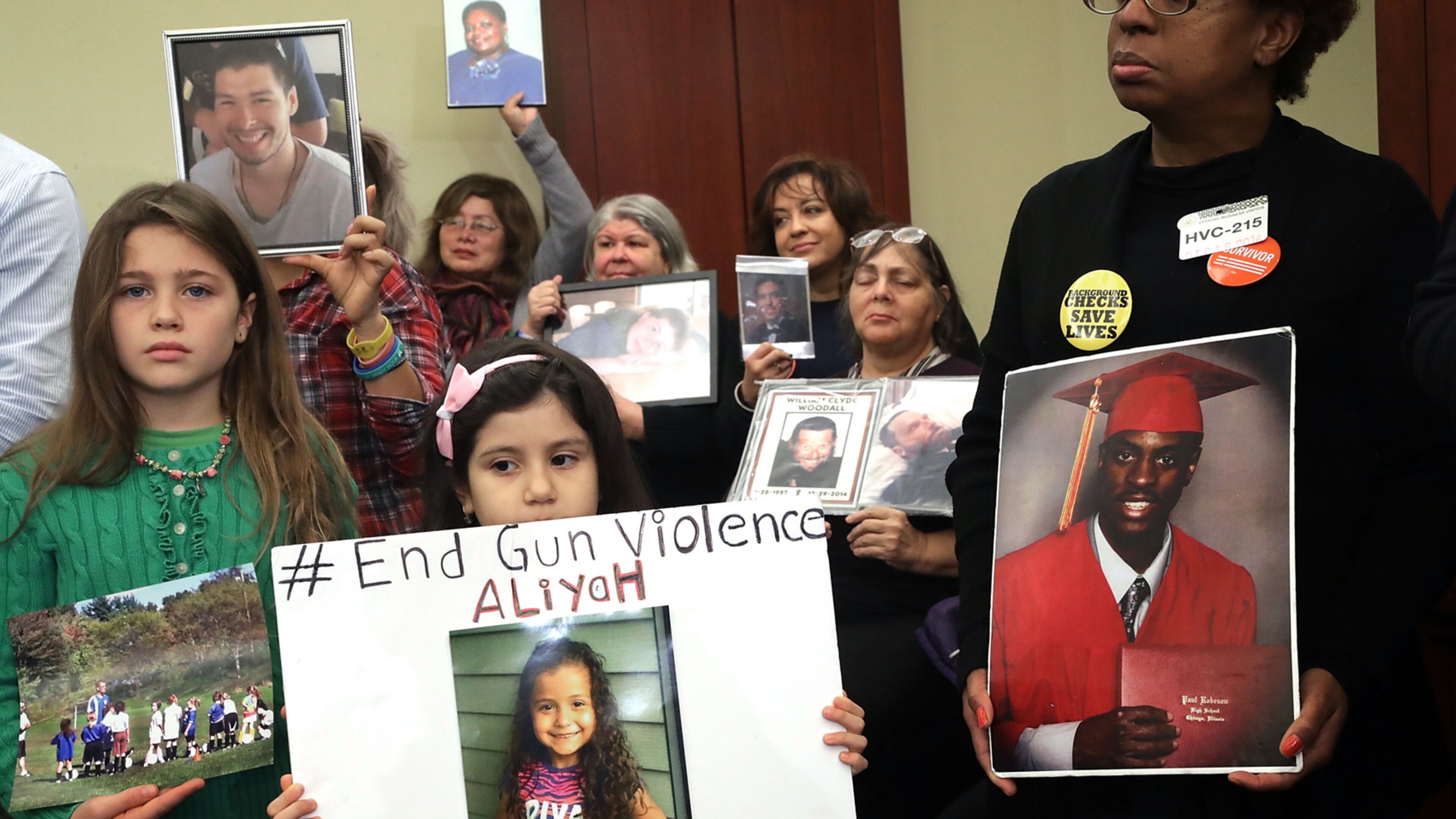 WASHINGTON, DC - DECEMBER 15: More than 80 family members and friends of people who were killed by gun violence gather for a news conference with Congressional Democrats to call for action on gun violence prevention at the U.S. Capitol December 15, 2016 in Washington, DC. The news conference comes on the heels of the 4th anniversary of the massacre of 20 students and 6 educators at Sandy Hook Elementary School. (Photo by Chip Somodevilla/Getty Images)