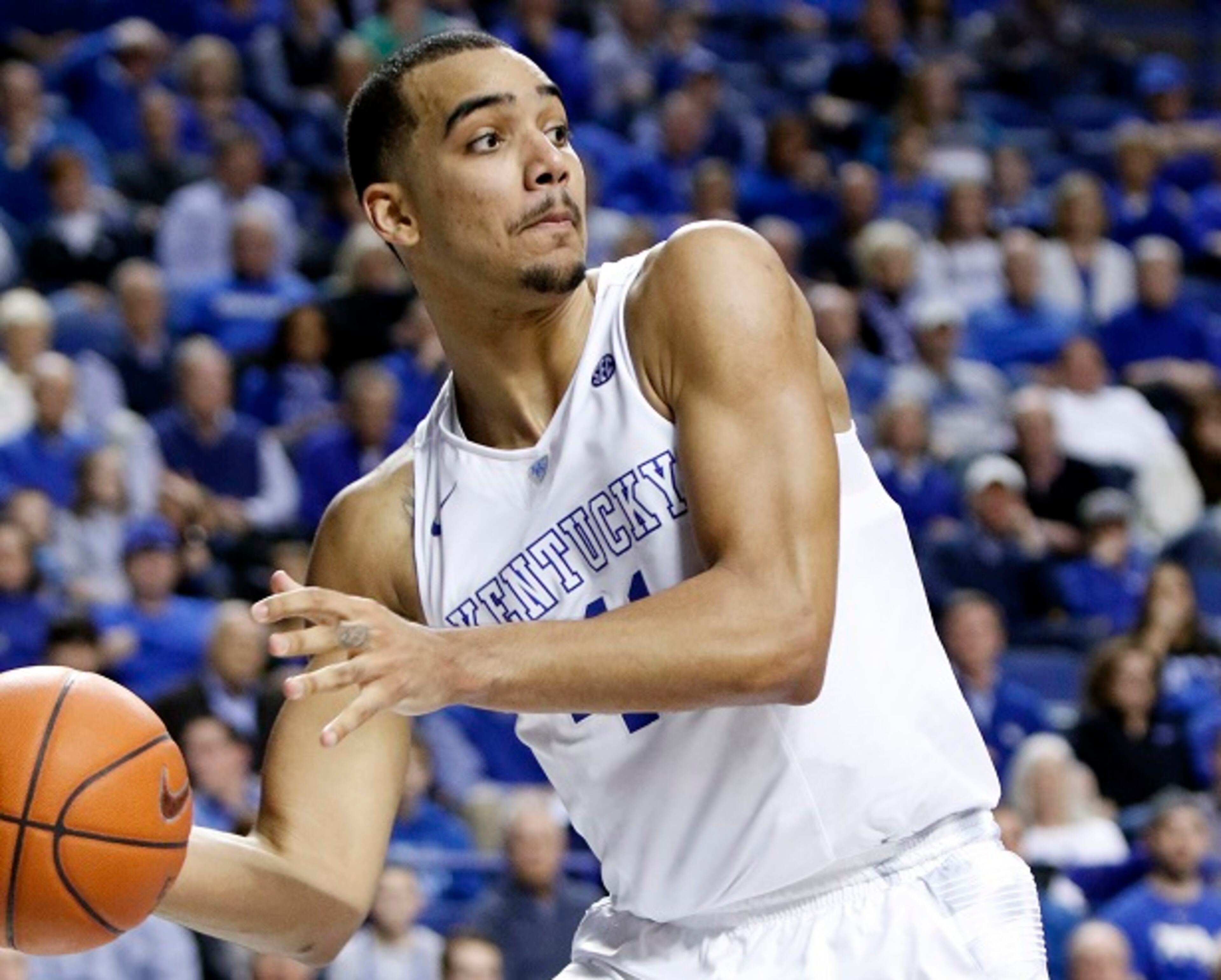 Kentucky's Trey Lyles saves a ball from going out of bounds during the second half of an NCAA college basketball game against Arkansas, Saturday, Feb. 28, 2015, in Lexington, Ky. Kentucky won 84-67. (AP Photo/James Crisp) Kentucky's starting small forward is Trey Lyles. He's 6-foot-10. (James Crisp/AP photo)
