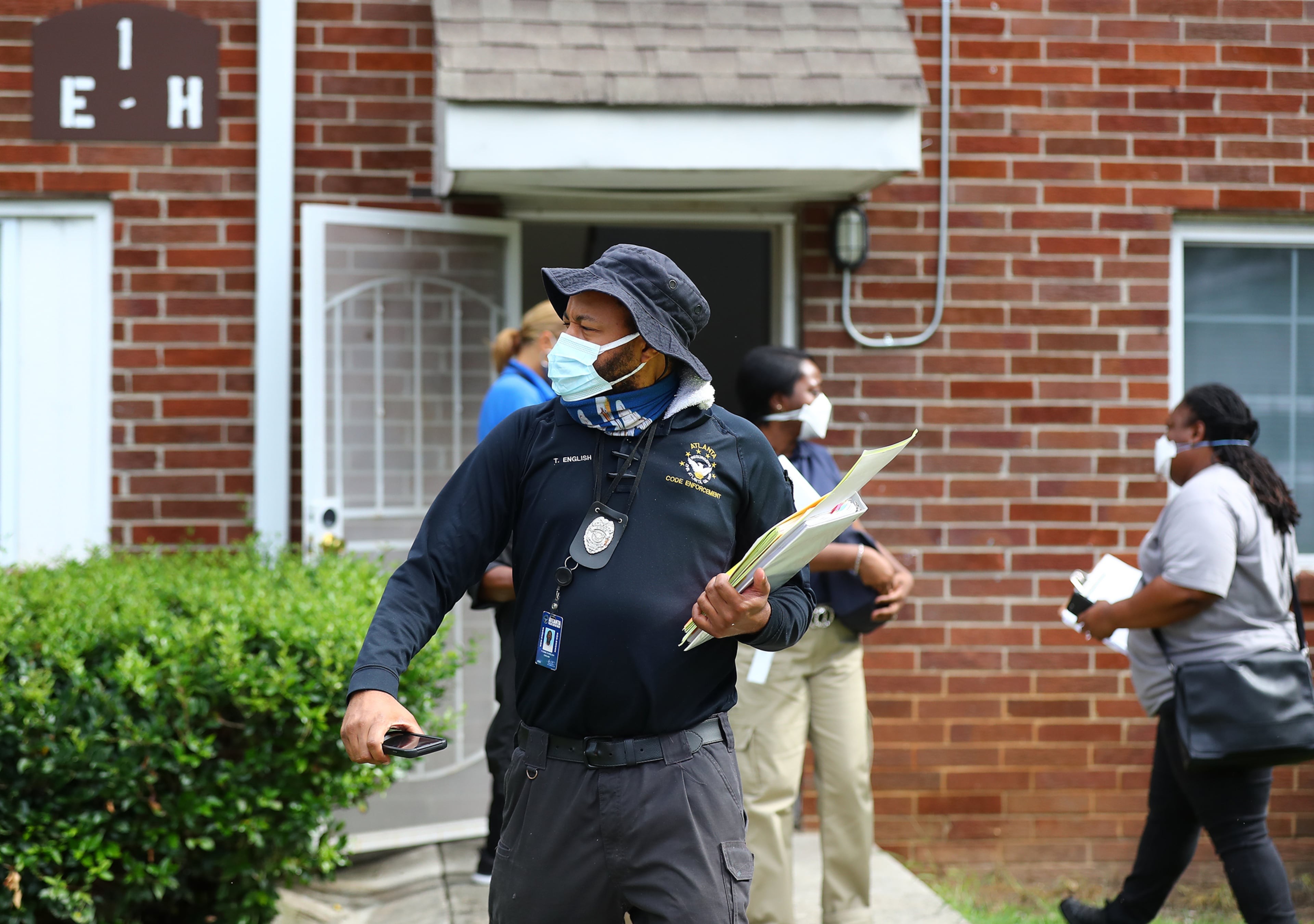 Atlanta code enforcement, zoning, and State Department of Community Affairs do a sweep of Pavilion Place apartments on Monday. Pavilion Place was one of the complexes featured in the AJC's "Dangerous Dwellings" investigative series. (Curtis Compton / Curtis Compton@ajc.com)