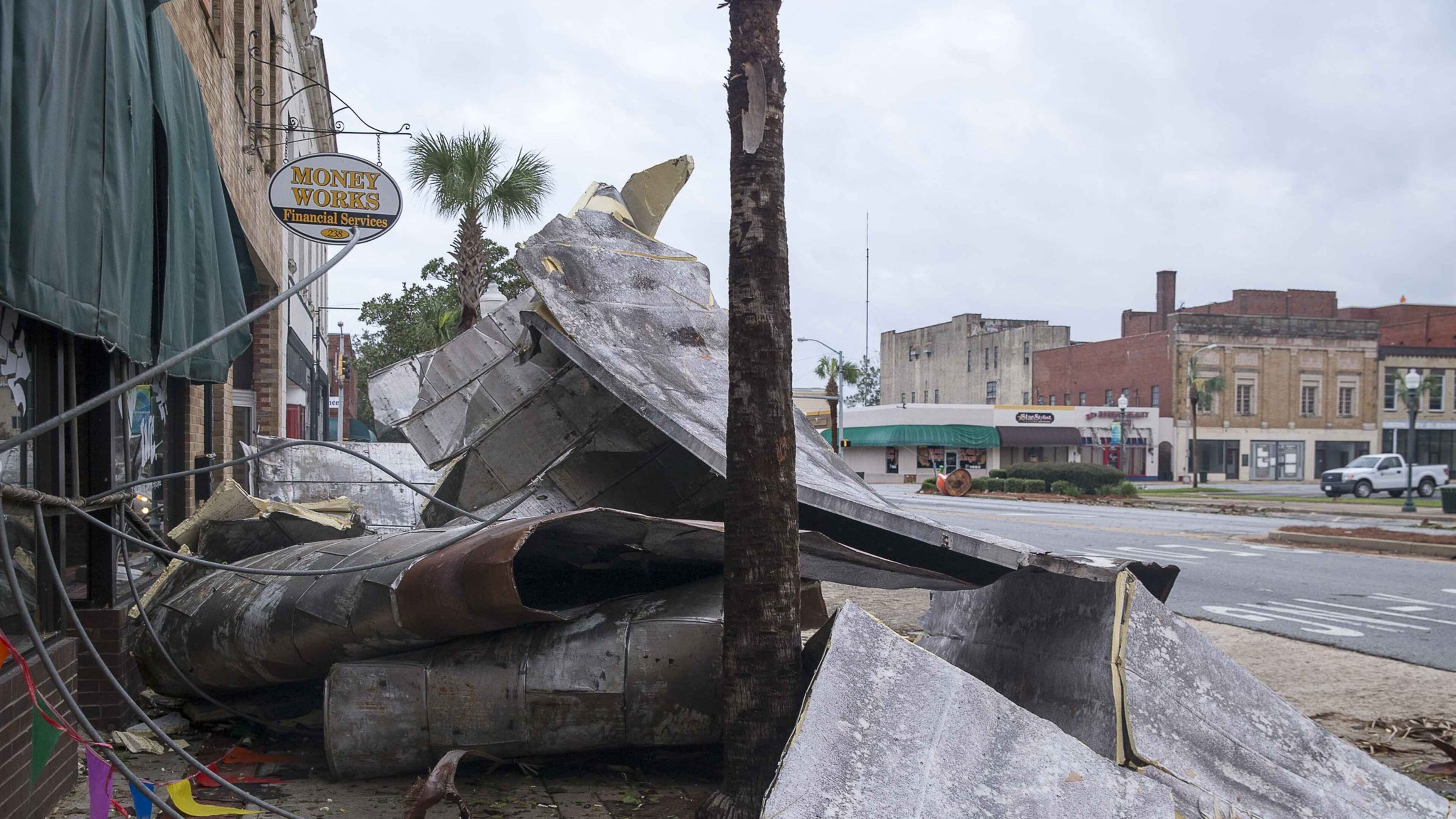 Debris lines the sidewalks on West Broad Avenue in Albany on Oct. 11 following Hurricane Michael. Georgia’s two U.S. senators unveiled a measure to provide funding for farmers in Georgia and other states recovering from Hurricane Michael. Estimates say damage from the storm could exceed $3 billion. (ALYSSA POINTER/ALYSSA.POINTER@AJC.COM)
