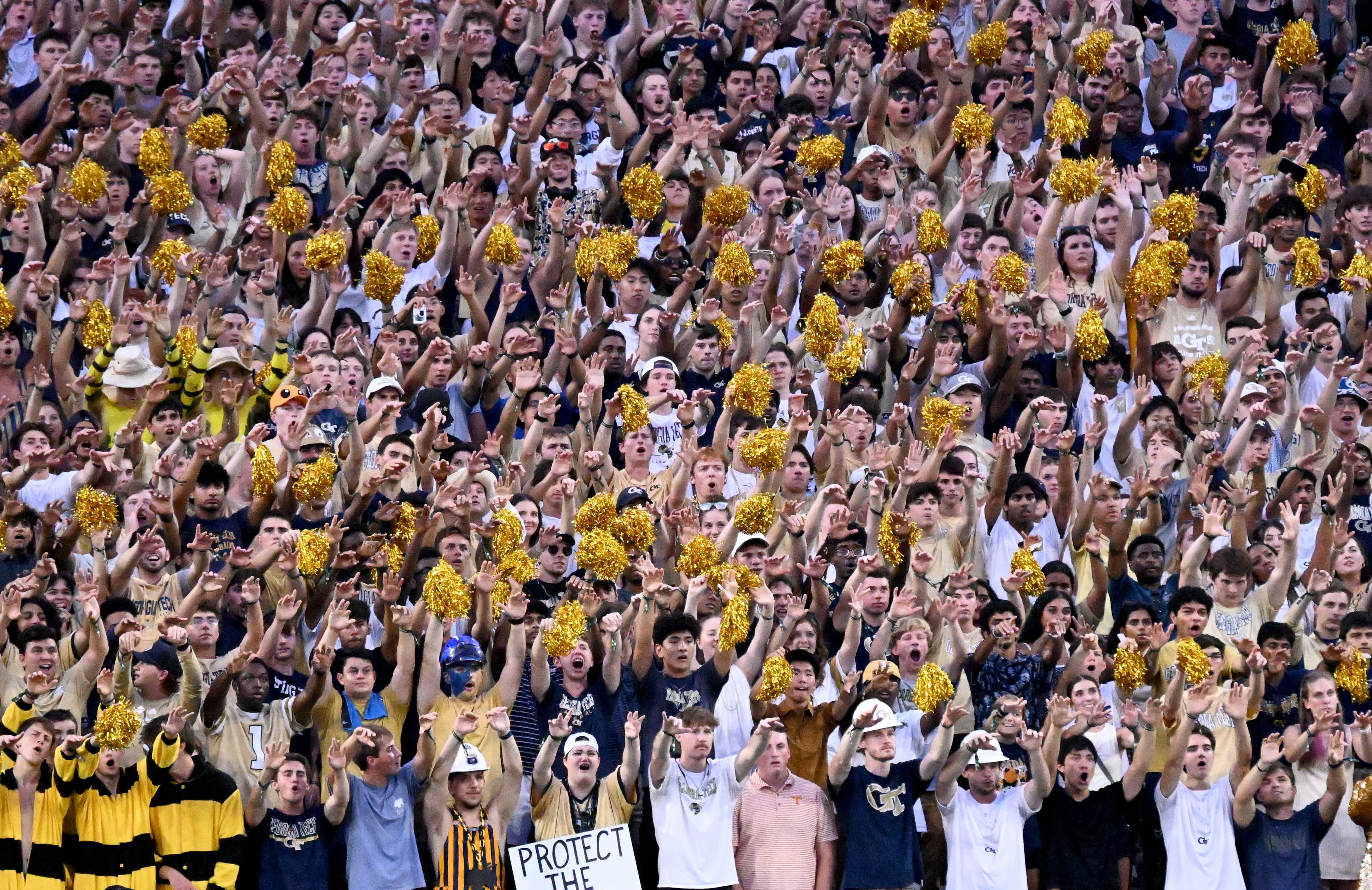 Apropos of, uh, absolutely nothing: Check out this beautiful photo of a diverse group of college students enjoying their football game. (Hyosub Shin/AJC)
